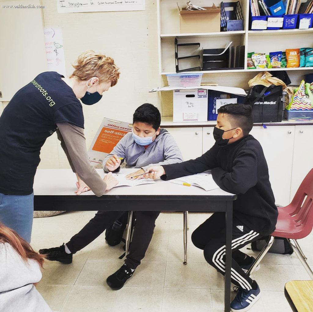 person tutoring a young student