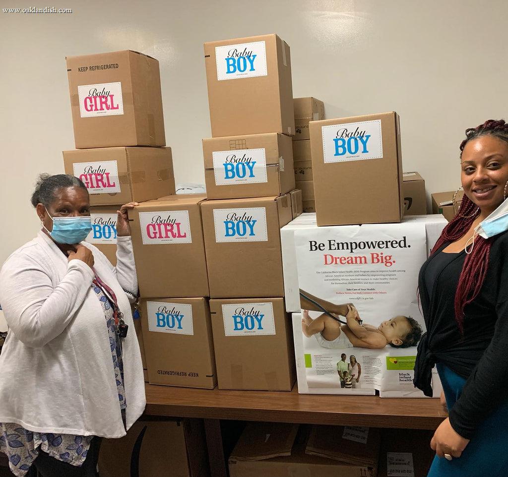 woman in front of boxes of donations