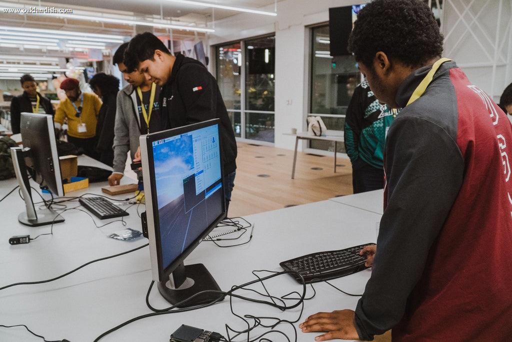 participants using computers in a classroom