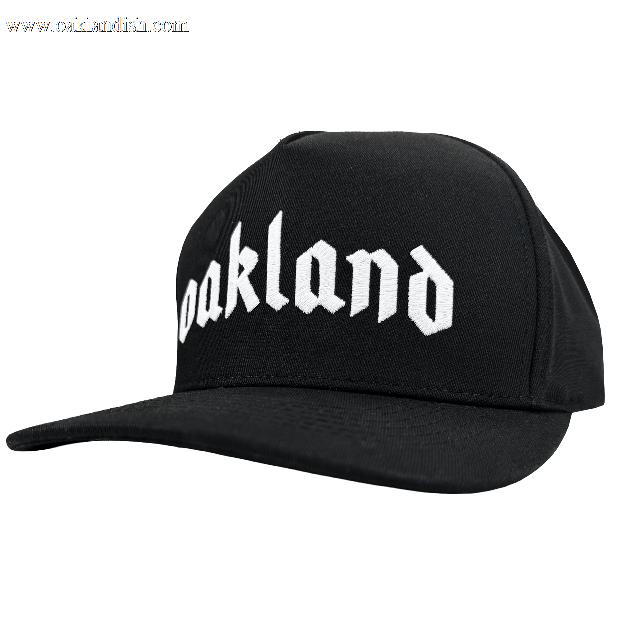 The Oaklandish Oakland 68s Panel Cap is a black snapback with "Oakland" boldly embroidered in white Old English style on the front. It features a flat brim and is displayed against a plain, light background.