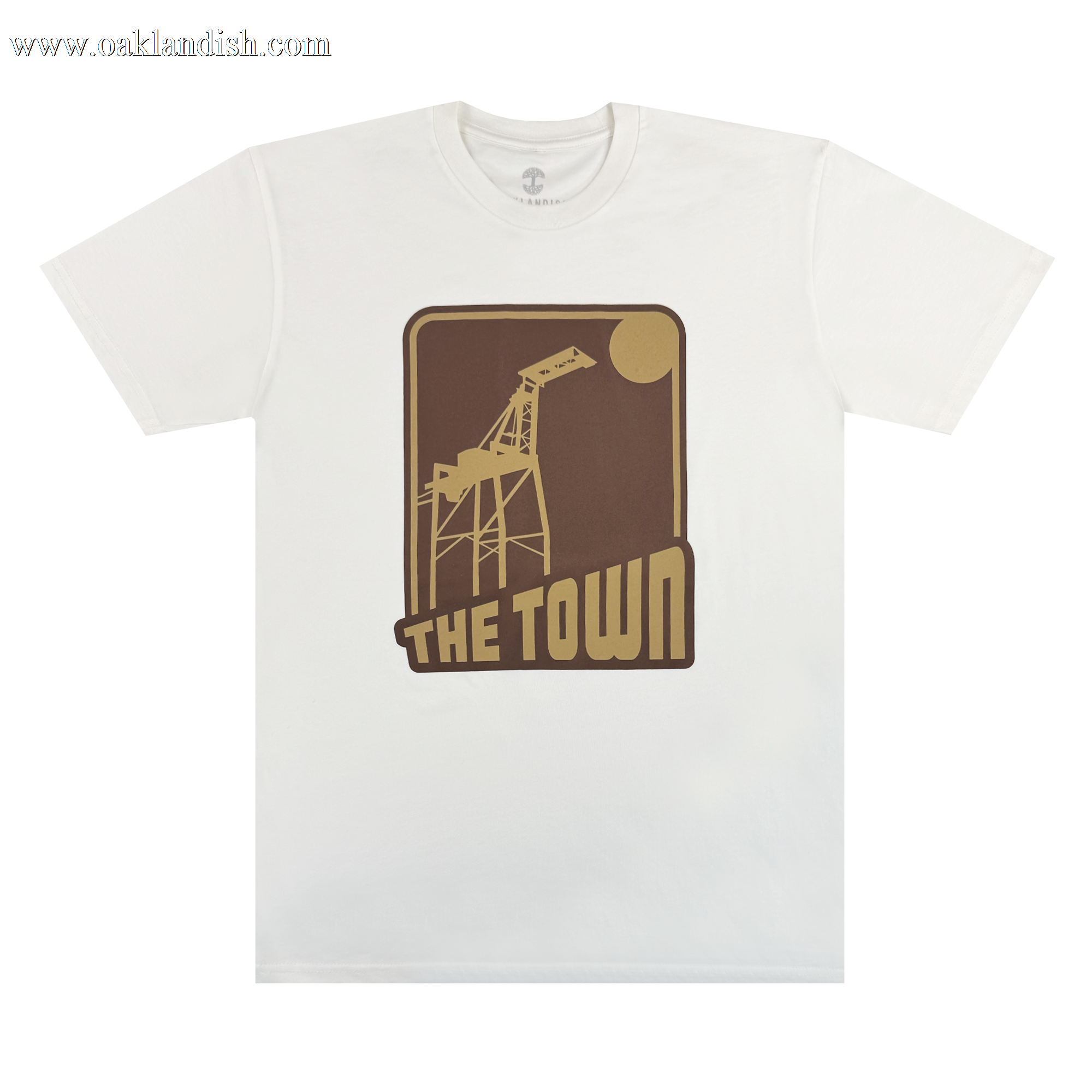 Introducing the 70's Trading Card Tee from Other—a crisp white T-shirt featuring a striking brown and tan graphic of a crane and sun, with “THE TOWN” boldly printed beneath in block letters to match. This design is centered on the chest, making it a standout piece that honors Oakland’s vibrant spirit.