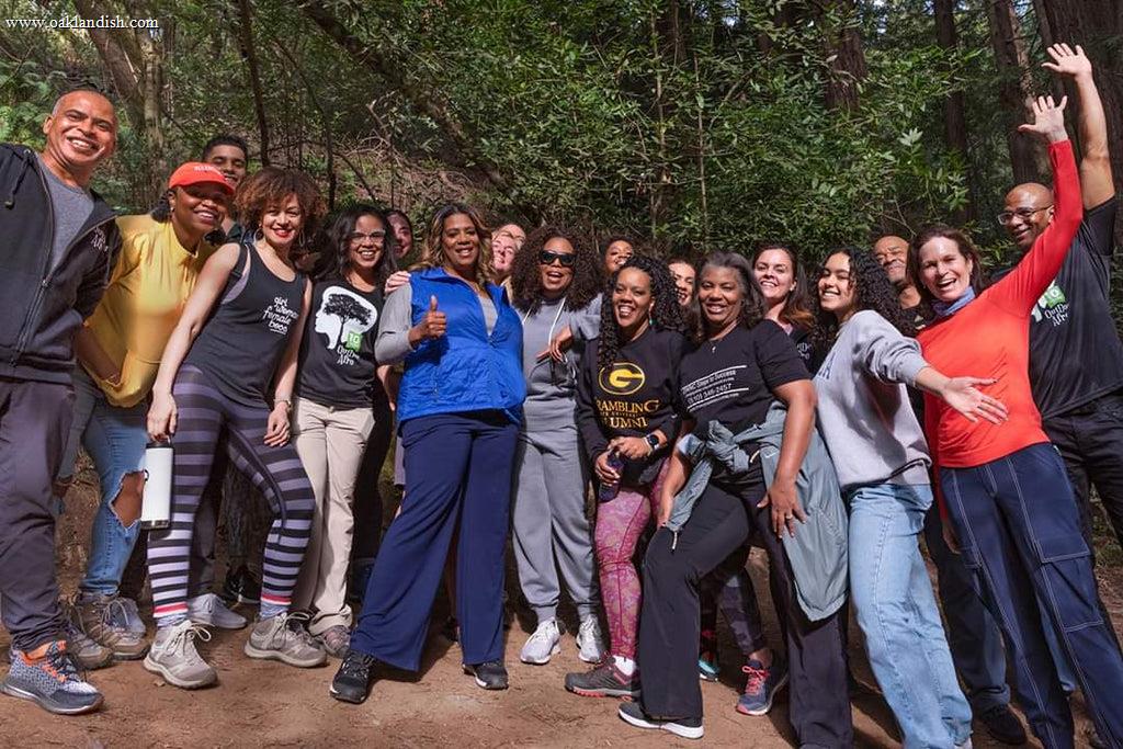 group photo of happy members including founder