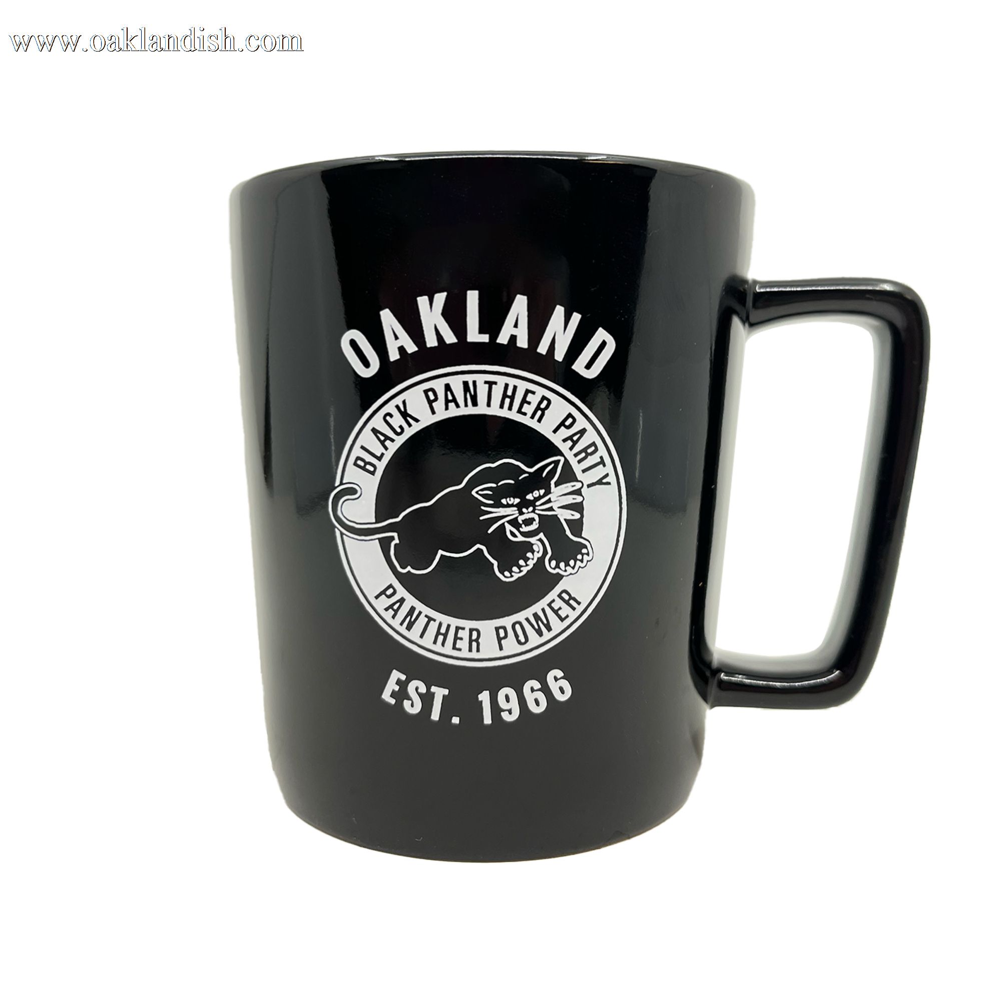 The Black Panther Party Power Mug by Oaklandish is a ceramic black mug showcasing a bold white circular logo with a dynamic panther illustration surrounded by the words "OAKLAND," "BLACK PANTHER PARTY," and "PANTHER POWER." The base prominently features "EST. 1966" in bold capitals.