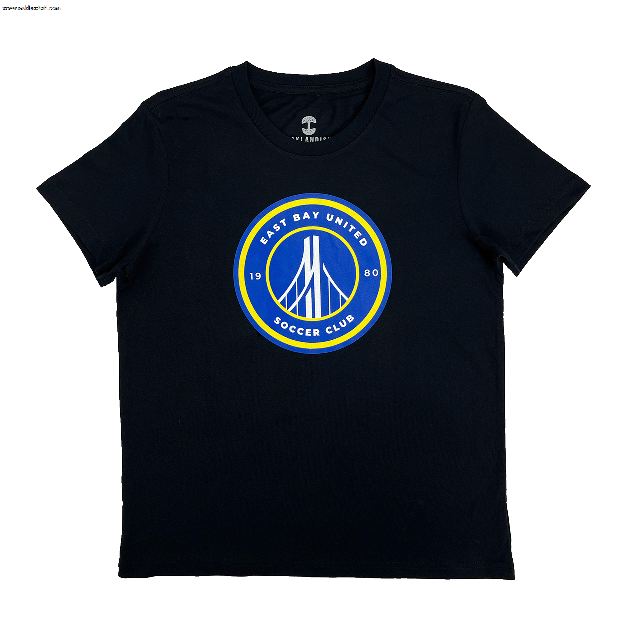 The EBU Women's Tee by Supported Brands is a black t-shirt featuring a circular emblem on the chest. The emblem, with yellow and blue borders, showcases a stylized white bridge illustration in the center. The text around the emblem reads "EAST BAY UNITED SOCCER CLUB" at the top and "1980" at the bottom, celebrating our vibrant youth soccer club.