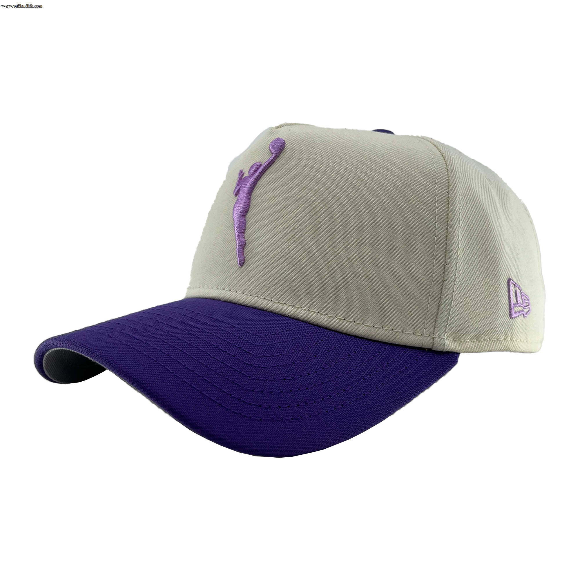 The GSV 9FORTY AF 2 Tone by GSV is a beige adjustable snapback with a purple brim, purple stitching, and an embroidered purple jumping silhouette on the front. A small purple New Era logo accents the left side. Background is plain white.