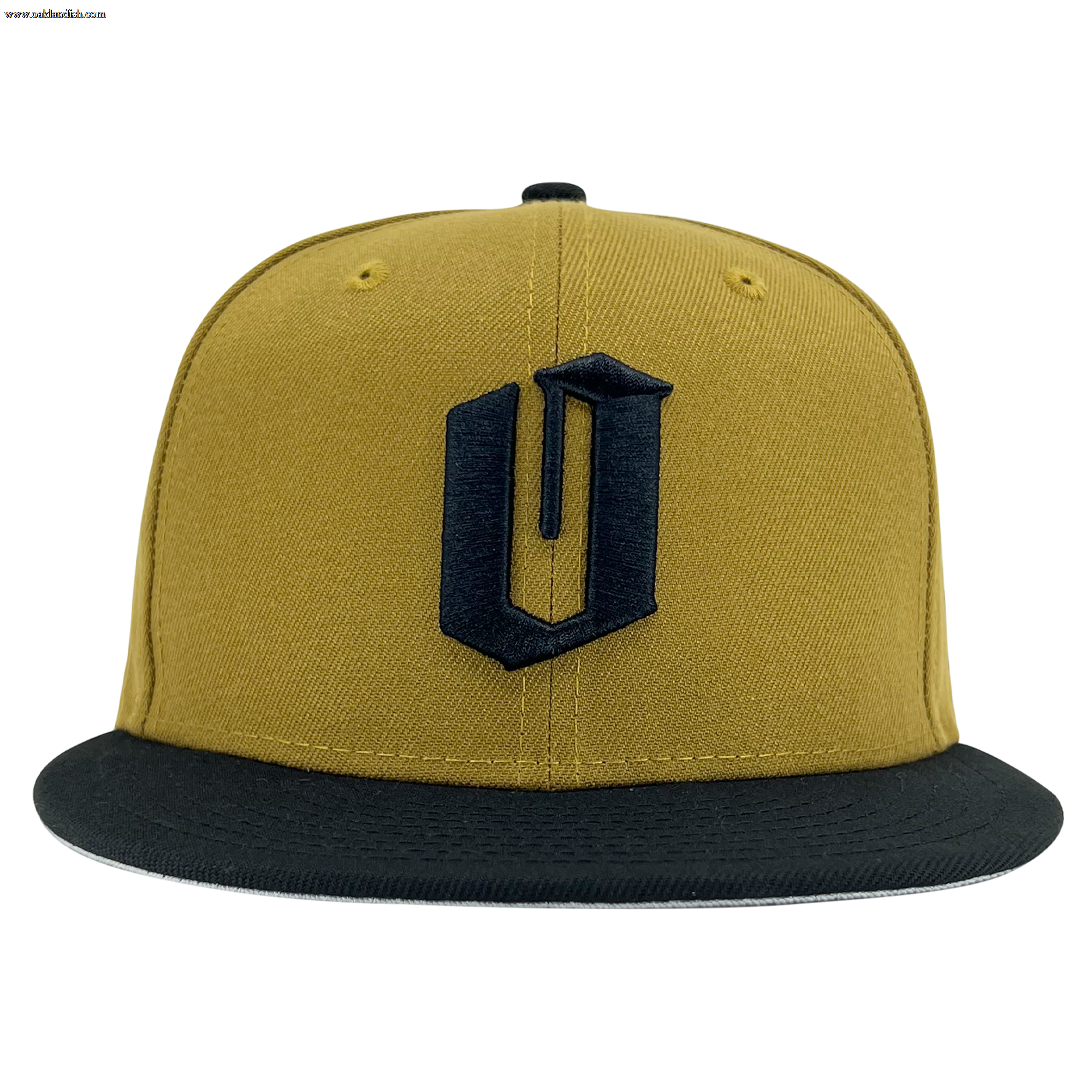 A yellow New Era Official 59FIFTY Fitted Cap by Other features a flat black brim and a prominent, stylized black letter “U” embroidered on the front panel. The cap is displayed head-on and centered against a plain white background.