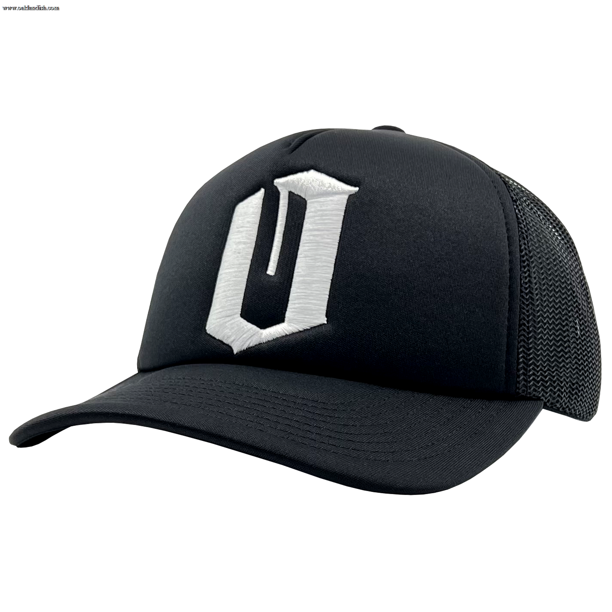 The Official O Trucker by Oaklandish is a sleek and modern black trucker snapback baseball cap. It features a curved brim and a breathable mesh back. The front panel showcases an embroidered white "O" design in a stylized, angular font, combining solid fabric on the front with mesh for optimal comfort.