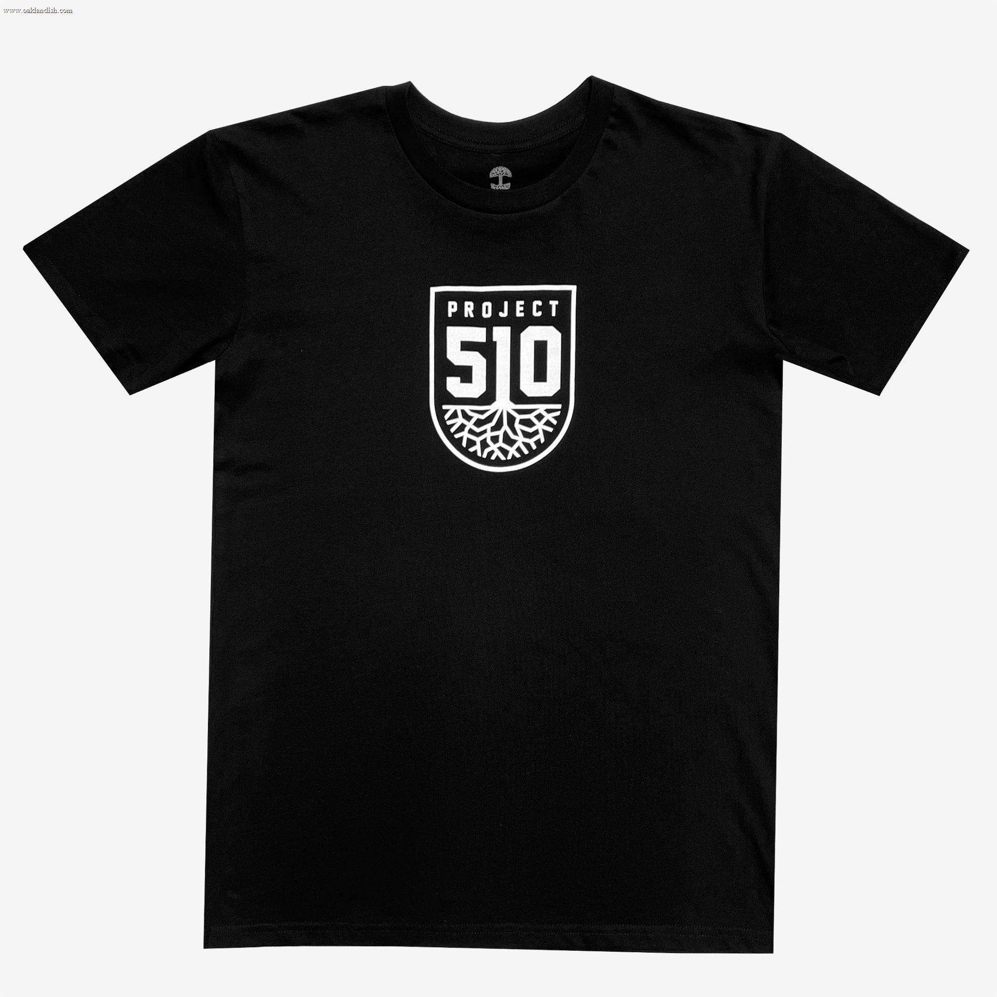 The Project 510 Club Tee by Oakland Roots SC comes in black and showcases a centered white graphic with the text "PROJECT 51O." The design features a shield-like emblem displaying the number "510" and a stylized root or tree pattern at the bottom, paying homage to Oakland Roots SC. The T-shirt is displayed on a plain white background.