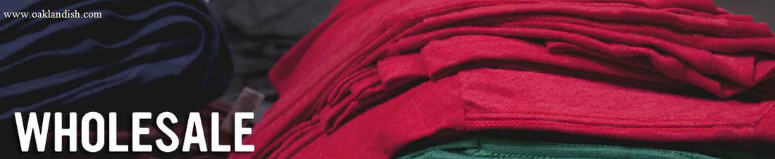 Close up of pink and purple fabric with word Wholesale imposed over the image.