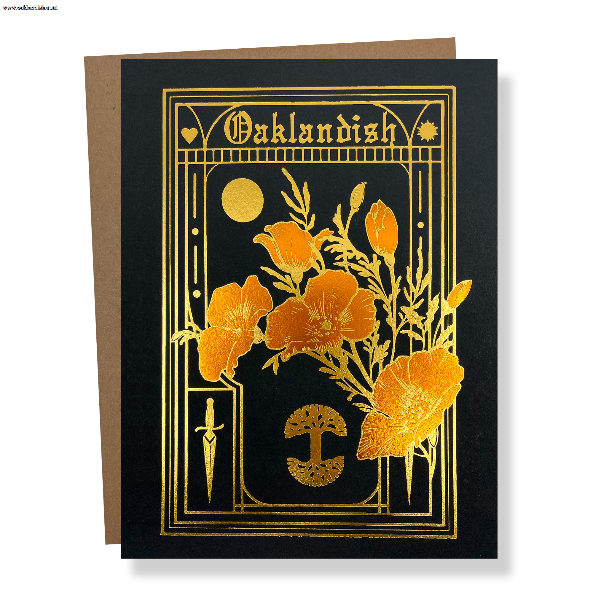 The Blossom Card by Never Elsewhere features a black background adorned with gold foil accents. Intricate designs on the card include flowers, a crescent moon, a dagger, and a fan-like motif, with "Oaklandish" elegantly written at the top in a stylized font. The card comes layered on a recycled kraft paper envelope.