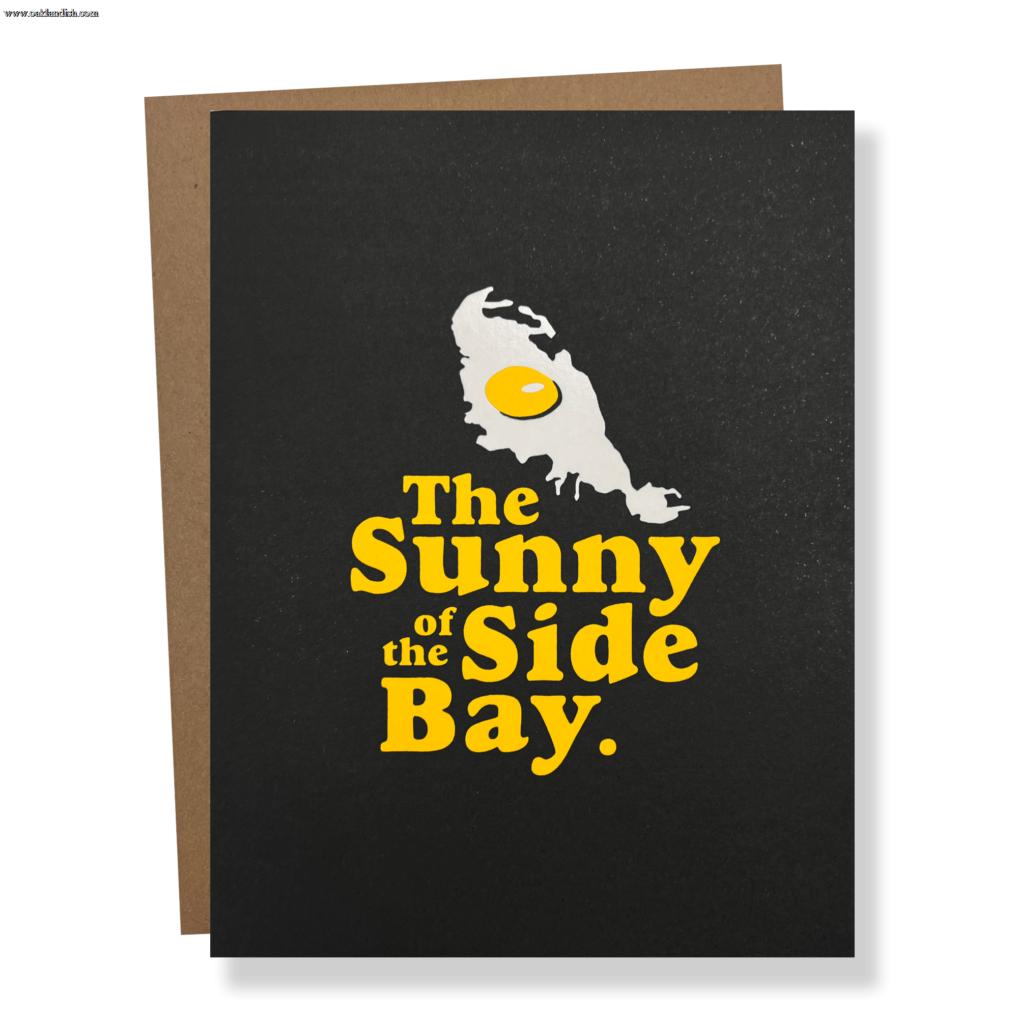 Black greeting card with The Sunnyside of the Bay wordmark and logo with a brown envelope.
