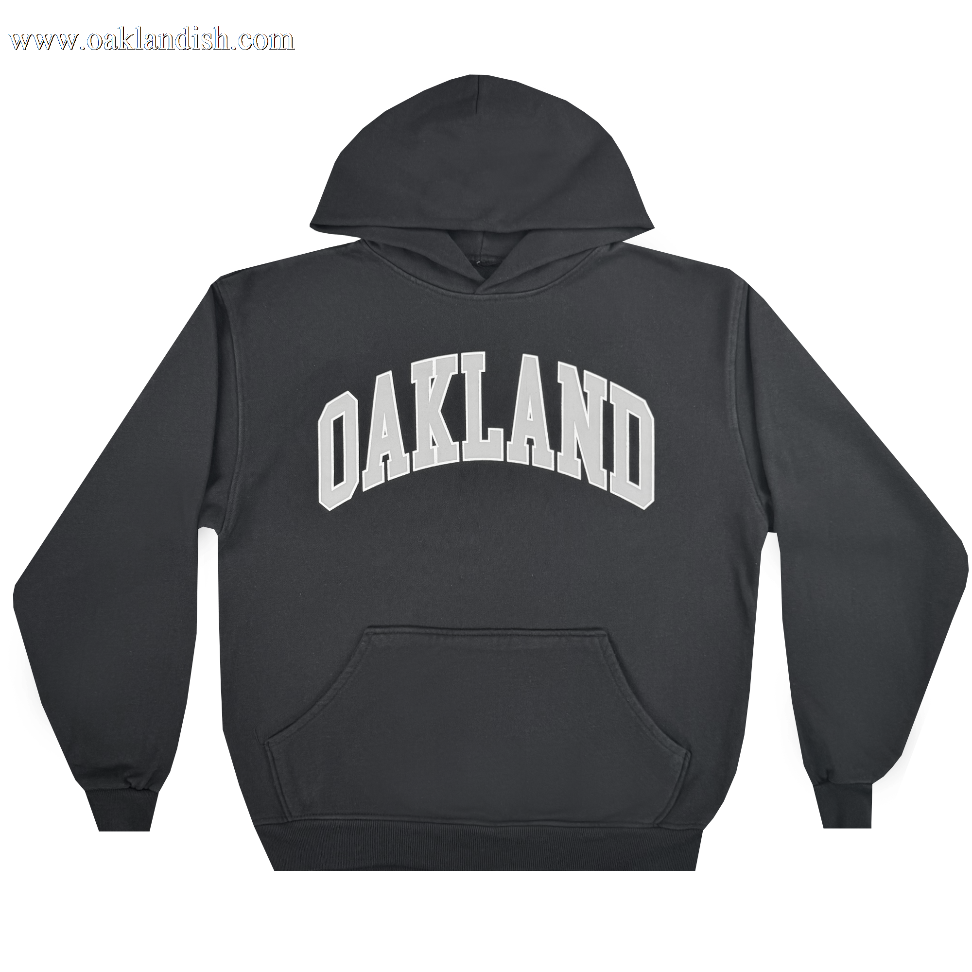 The Oaklandish Alma Mater Hoodie 2.0 is a black men's pullover with a front pocket, featuring bold white "OAKLAND" varsity letters across the chest. The oversized fleece sweatshirt is shown laid flat on a plain white background.