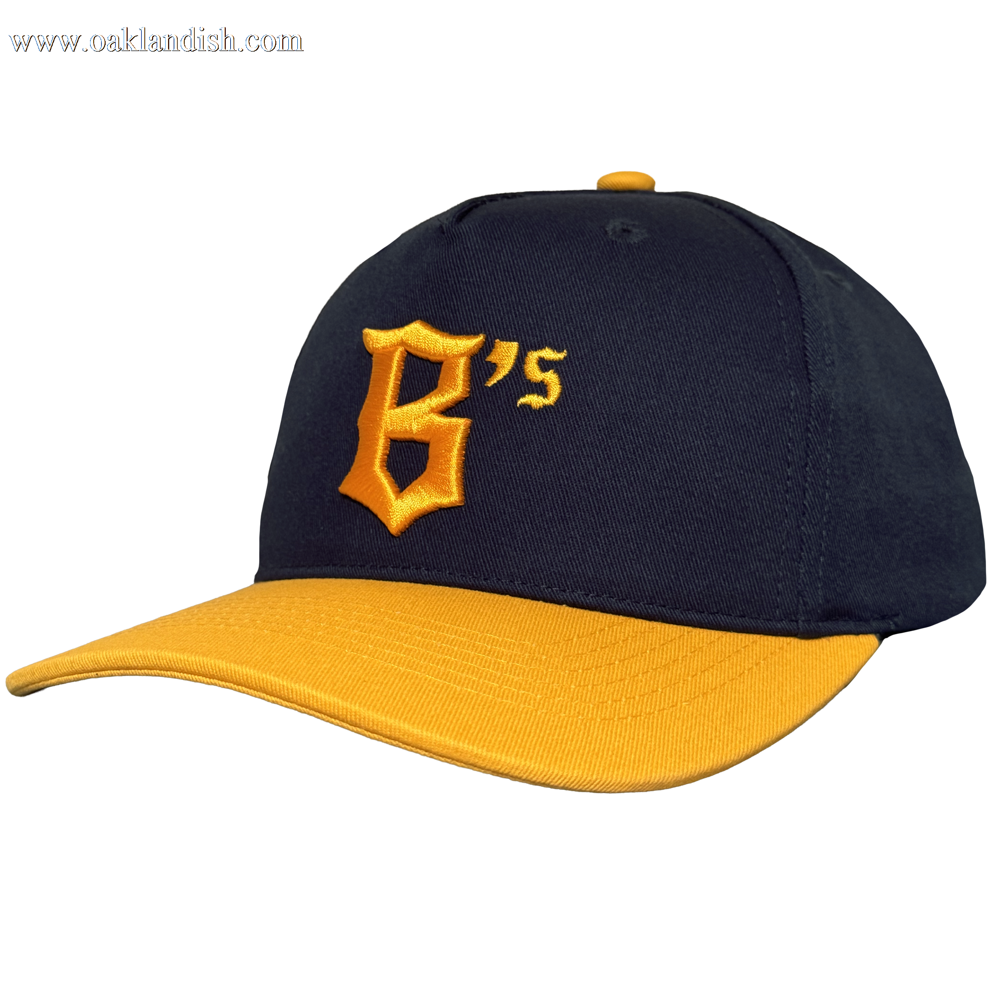 The Oakland Ballers 5 Panel Cap features a black snapback design with a curved yellow brim, bold yellow “B’s” logo, and matching top button—ideal for any Oakland baseball fan. Brand: Oakland Ballers. Plain white background.