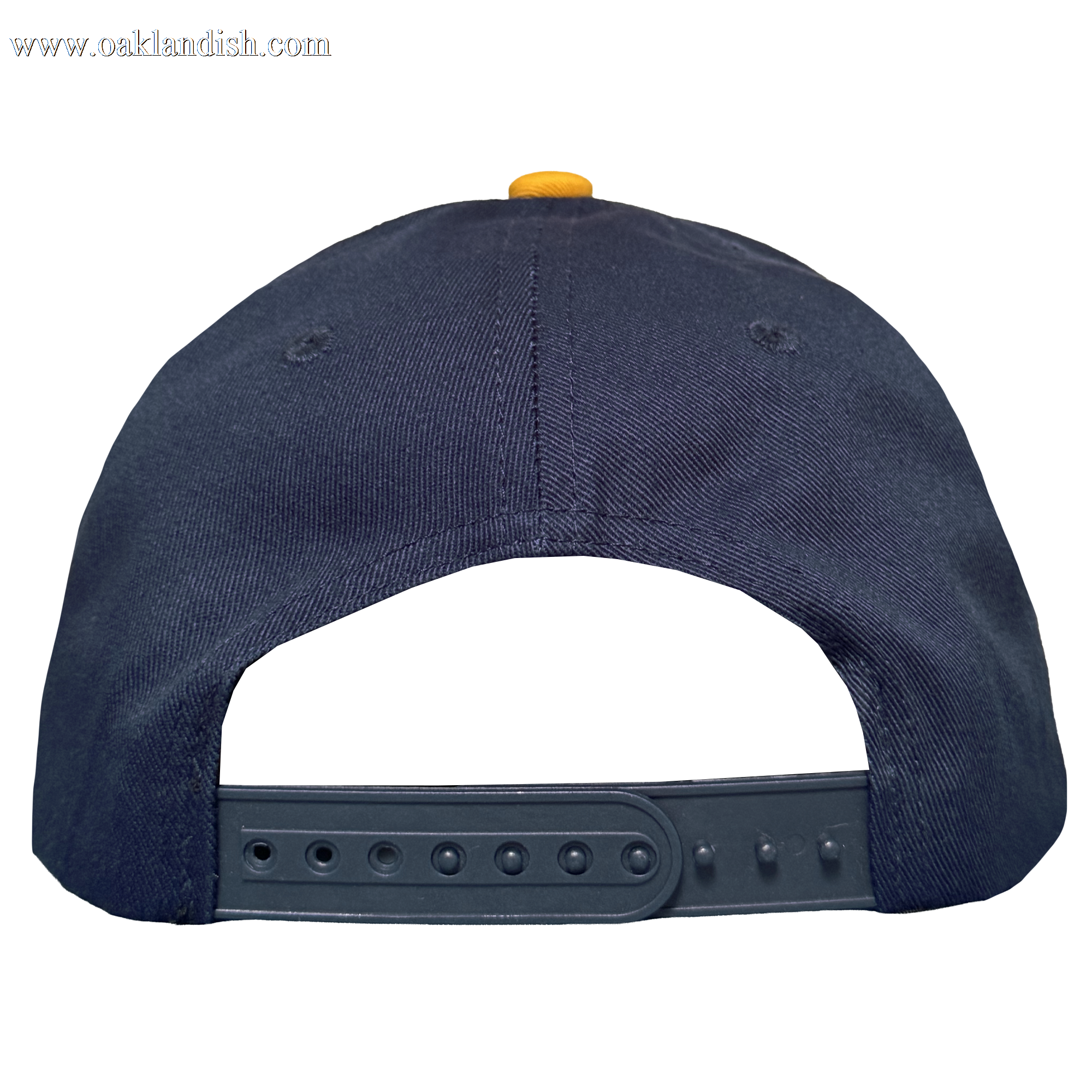 The Oakland Ballers 5 Panel Cap is a navy blue snapback with a plastic adjustable strap and yellow top button, seen from the back against a plain white background. Brand: Oakland Ballers.