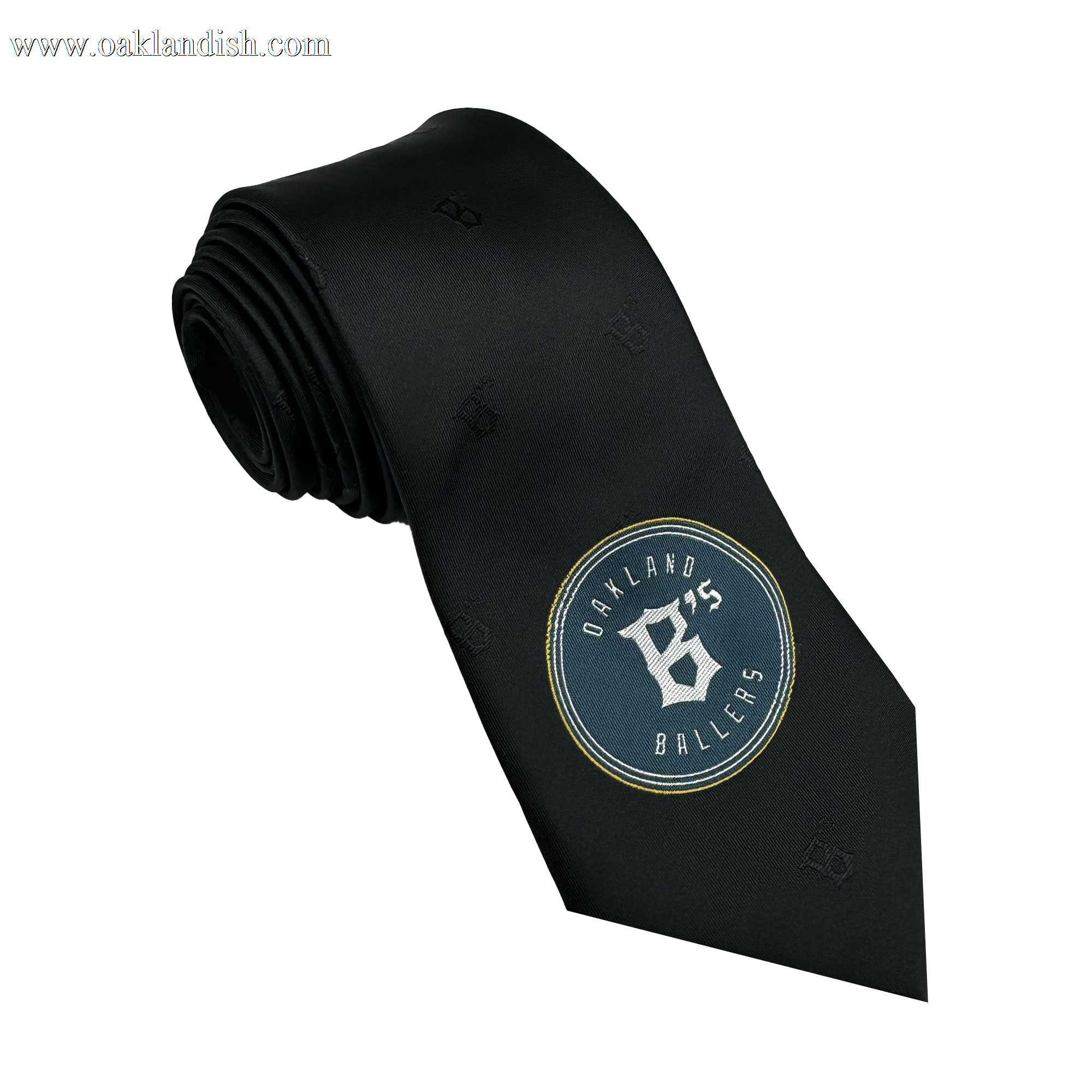 The Oakland Ballers Tie from the Oakland Ballers brand is a rolled black tie that showcases the team's logo near the bottom. The circular design prominently features "Oakland Ballers" with a stylish white "O" and "B," complemented by subtle embossed letters for an elegant touch, celebrating the essence of Pioneer League style.