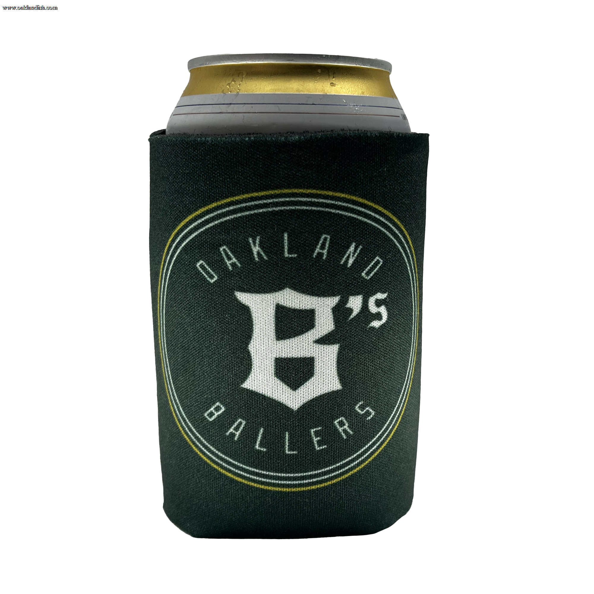 A can of beverage is held in a dark green Oakland Ballers 12oz Can Cooler, showcasing the logo of the new professional baseball team, the "Oakland Ballers." The logo consists of a stylized "B" and the text "OAKLAND BALLERS" encircling it, all in white letters. The beverage can has a silver top with a partially visible gold tab.