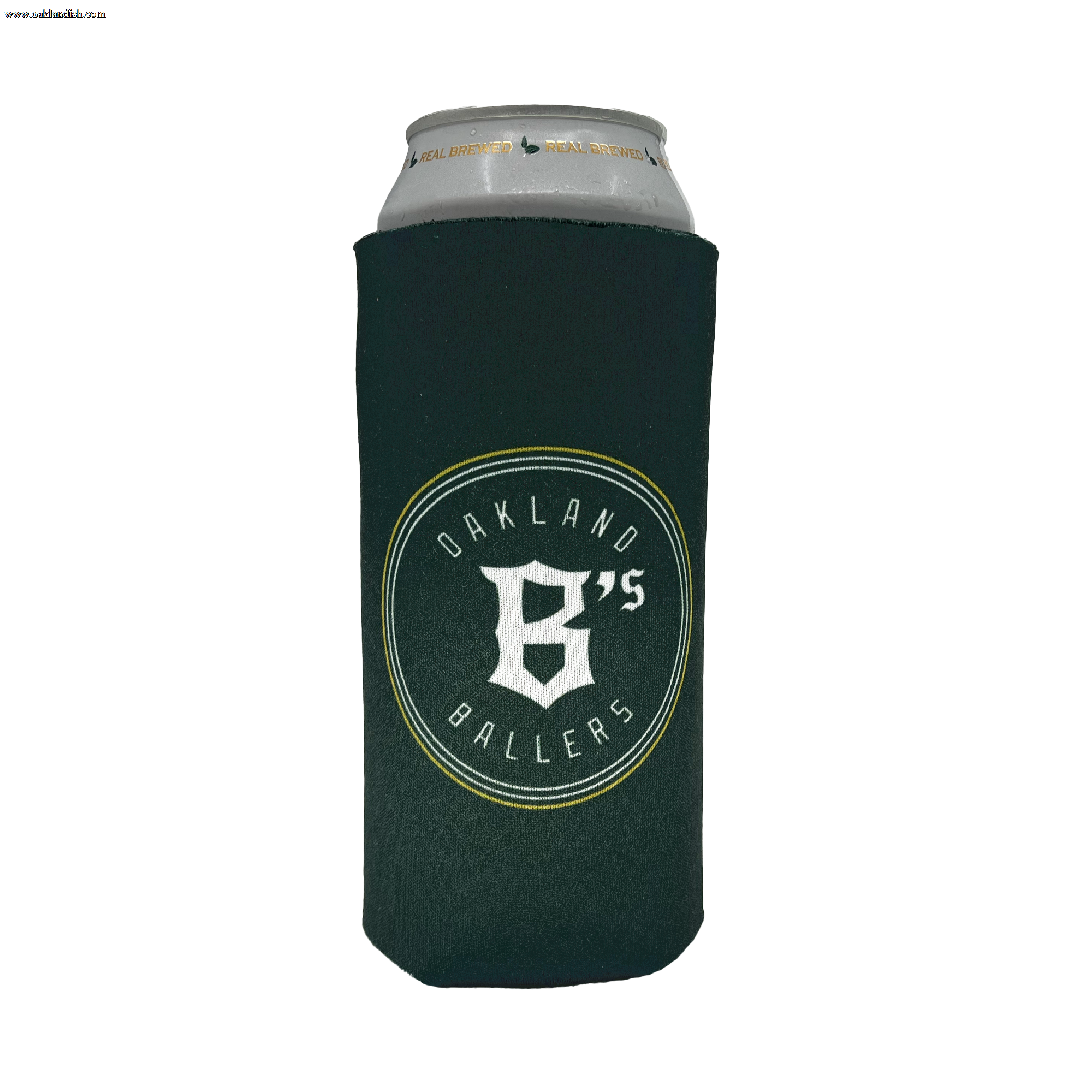 A silver can is wrapped in an Oakland Ballers 24oz Can Cooler. The dark green cooler features the logo and text "OAKLAND BALLERS," celebrating Oakland's New Pro Baseball Team in the Pioneer League, with a prominent letter "B" and the number "6" combined in the center. The cooler is designed to keep beverages cool.
