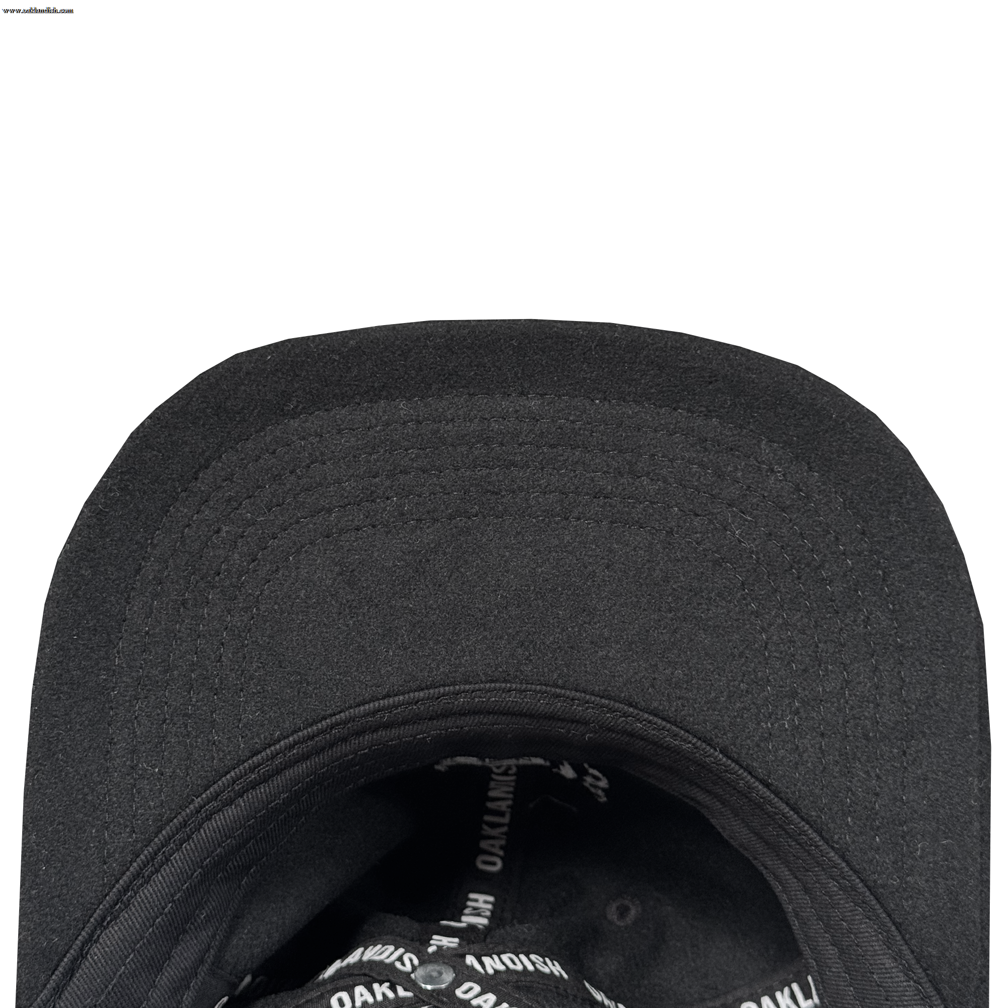 Close-up of the Oakland Ballers B Strapback underside with a curved brim and interior lining. The black sweatband area features repeated white "OAKLAND BALLERS" branding. The hat is shown against a white background.