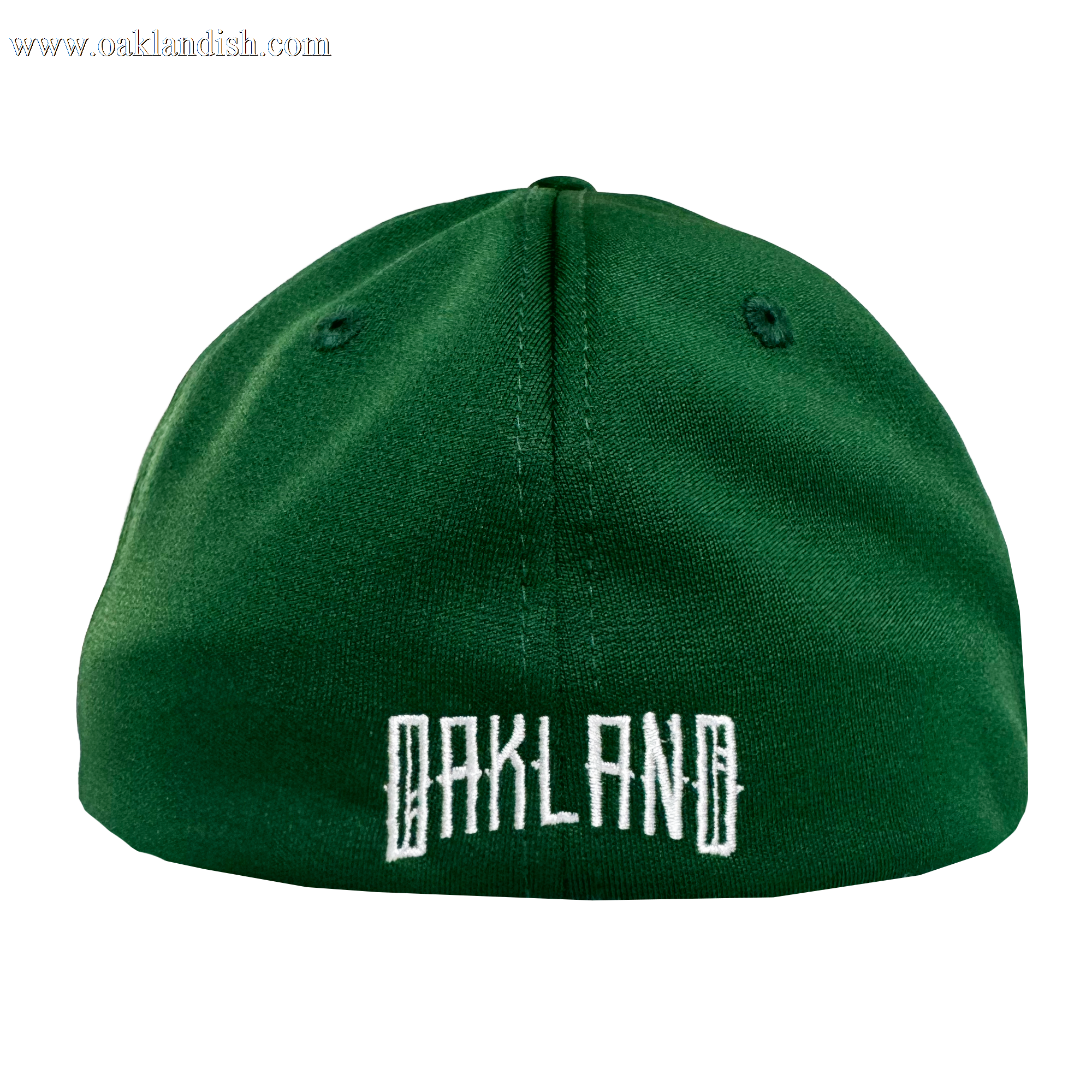 The Oakland Ballers Logo Flexfit Hat, by Oakland Ballers, is shown from the back in green with “OAKLAND” embroidered in bold white block letters. Two black ventilation eyelets are on top against a plain white background.