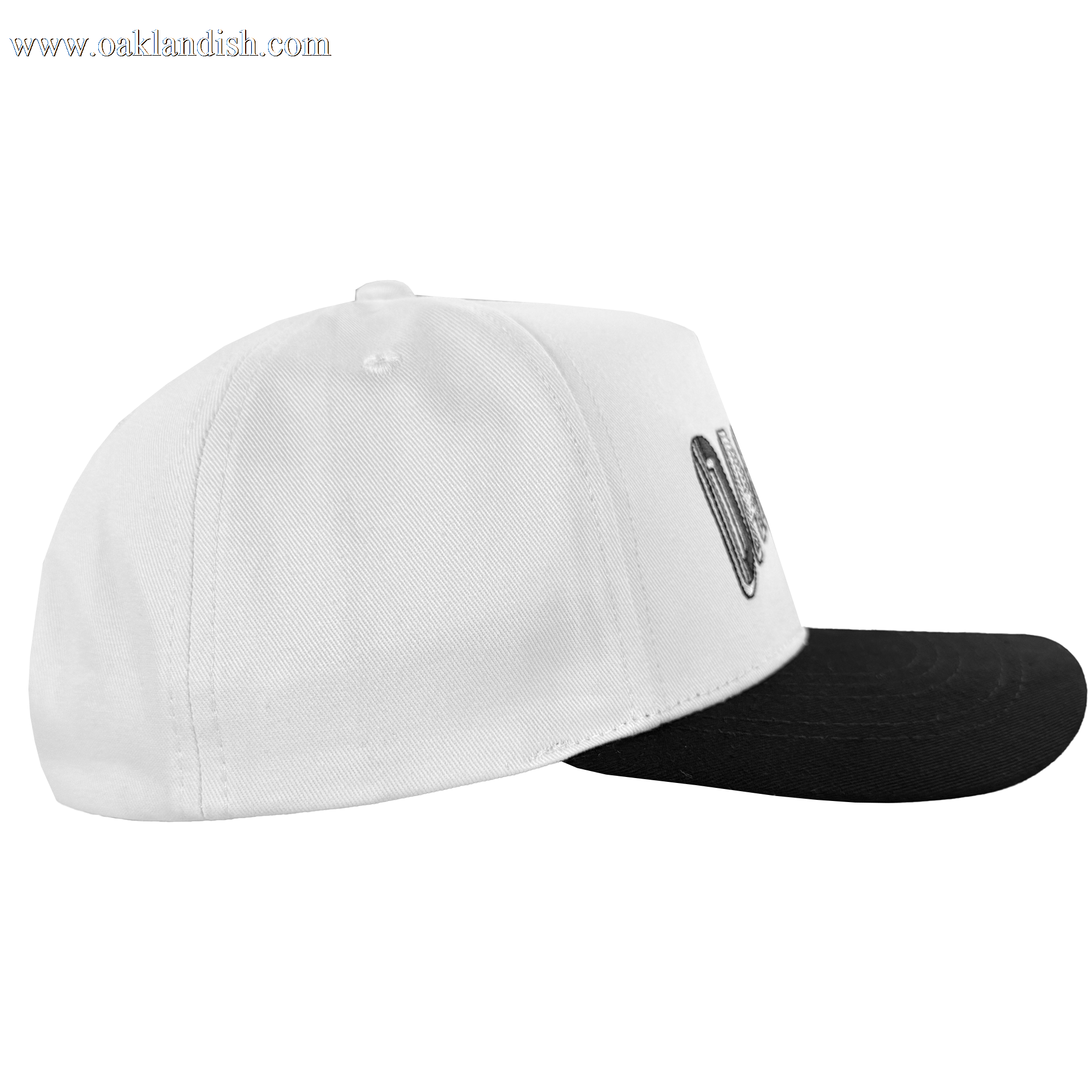 A side view of the Oakland Ballers Oakland Beisbol 5 Panel Cap, featuring a white crown, flat black brim, visible stitching, a partially shown Oakland Ballers logo on the front panel, small top button, and a plain white background.