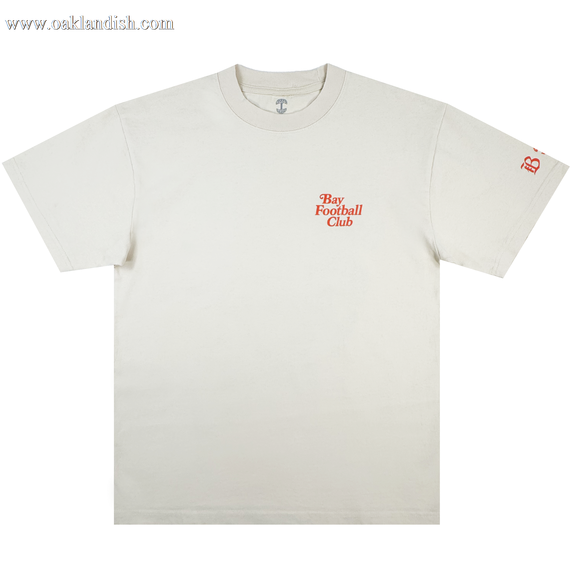The Bay FC Jubilee Tee is a classic fit, heavy-weight cotton shirt in off-white, featuring "Bay Football Club" in small orange chest text and a matching "B" logo on the left sleeve. It has a crewneck and short sleeves. Brand: Bay FC.