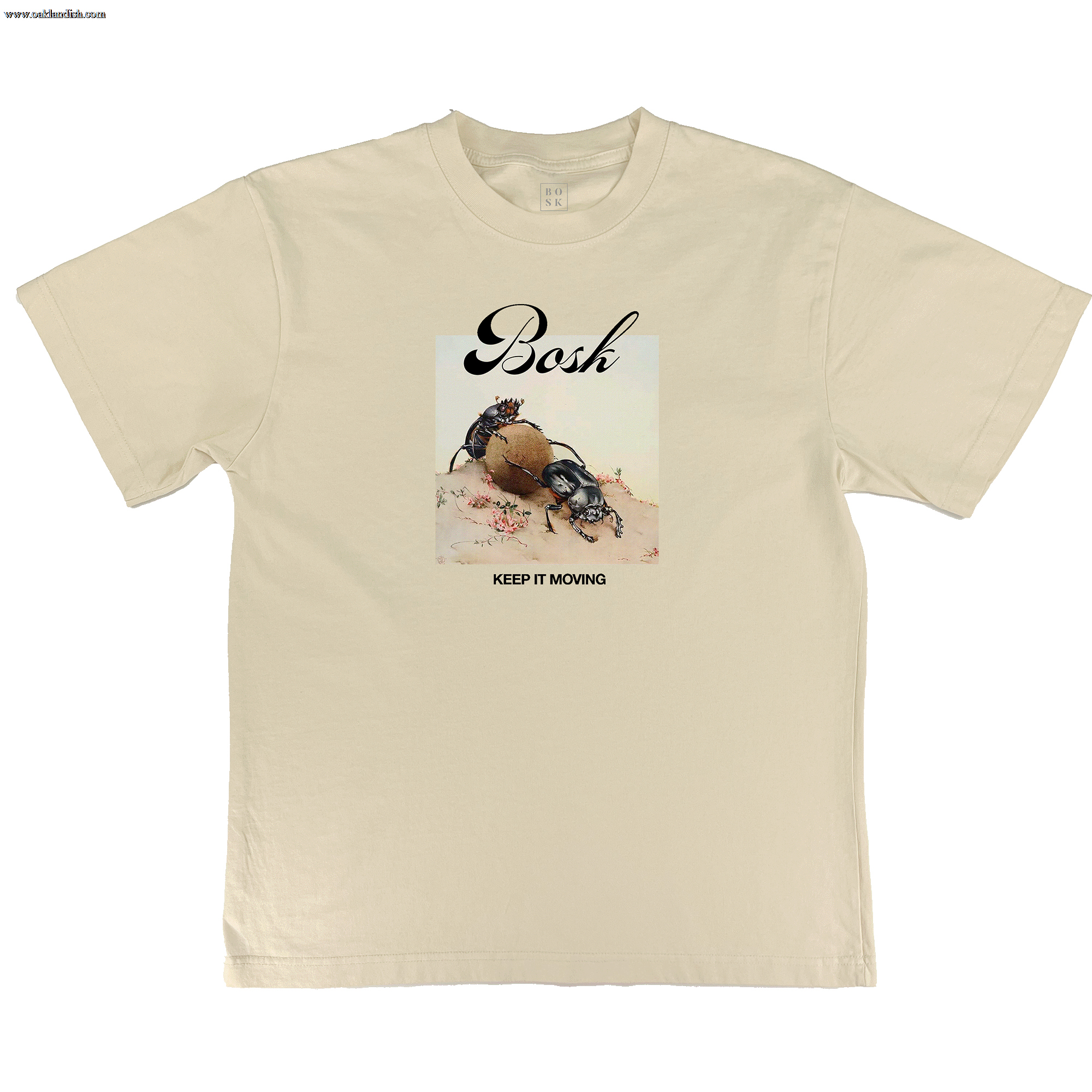 The BOSK Moving Tee is an off white, classic fit shirt featuring a dung beetle rolling a ball with small plants, “Bosh” above in script, and “KEEP IT MOVING” below the artwork.