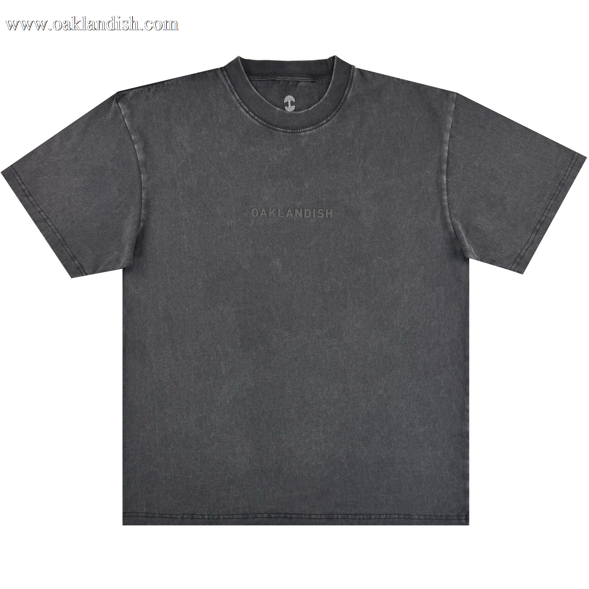 The Oaklandish Classic Logo Tee by Oaklandish is a heavyweight black cotton shirt with "OAKLANDISH" subtly printed across the chest. It features a classic crew neckline and visible stitched seams, shown laid flat on a light background.