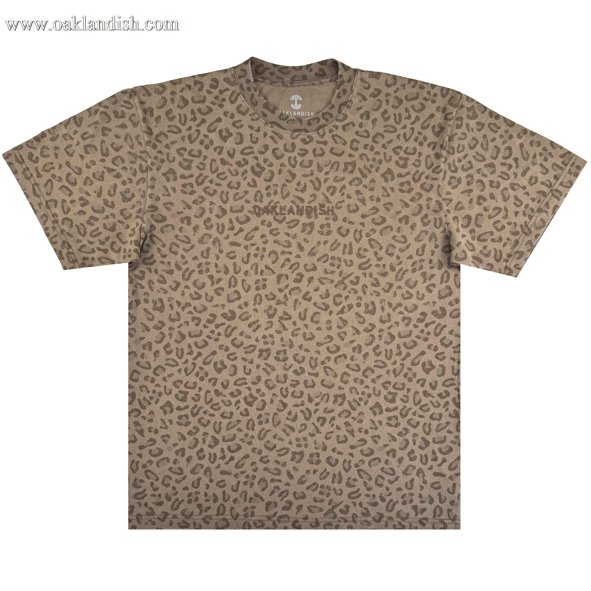 The Oaklandish Classic Logo Tee by Oaklandish is a men's oversized, heavyweight cotton short-sleeve crew-neck t-shirt in brown and tan leopard print with a subtle logo on the chest, set against a plain white background.