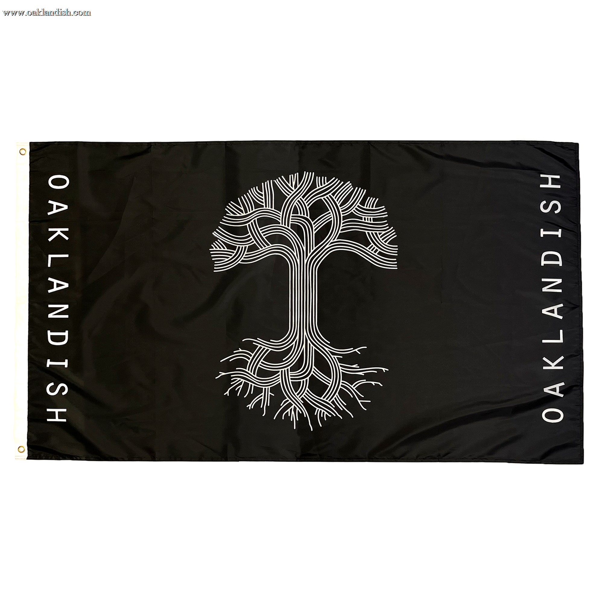 The Oaklandish Classic Logo Flag by Oaklandish features a rectangular black background with a striking white tree design at its center. The intricate branches extend to the flag's edges, and "OAKLANDISH" is boldly written vertically along both the left and right sides in white letters. Made from knit polyester, this flag includes two gold grommets on the left side for easy hanging.
