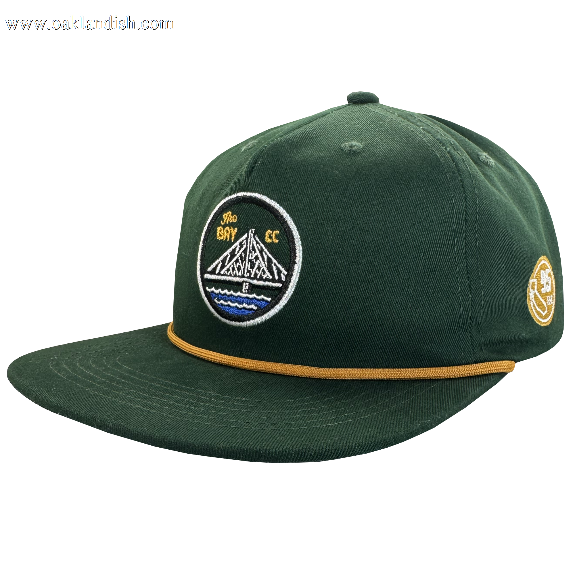 The Bay Area 5 Panel By DOC by Oaklandish features dark green fabric, a flat brim with gold rope detail, and embroidered patches—a “The Bay CC” bridge design up front and a yellow “35” on the side. Part of The Bay Collection.