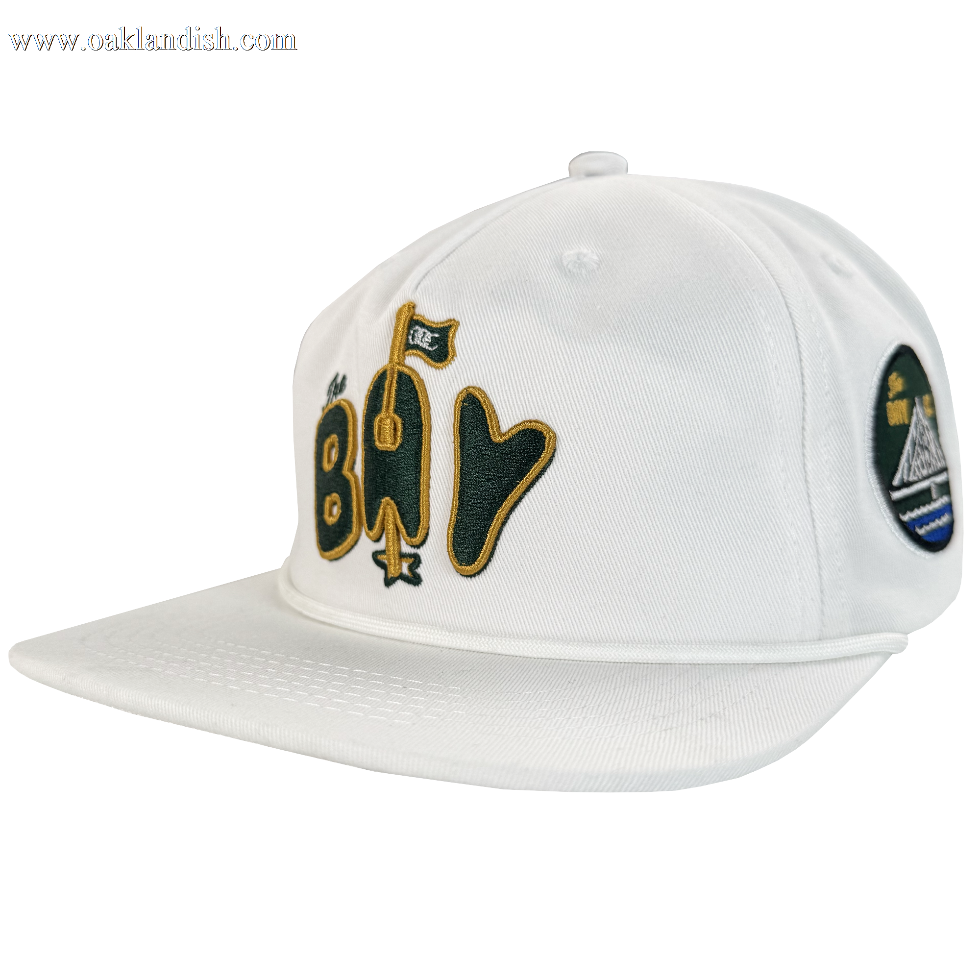 The Bay Area 5 Panel by DOC from Oaklandish is a white, unstructured baseball cap with stylized yellow and black "Bay" text and a flag graphic. Part of The Bay Collection, it features a flat brim, visible stitching, and an adjustable strap back.