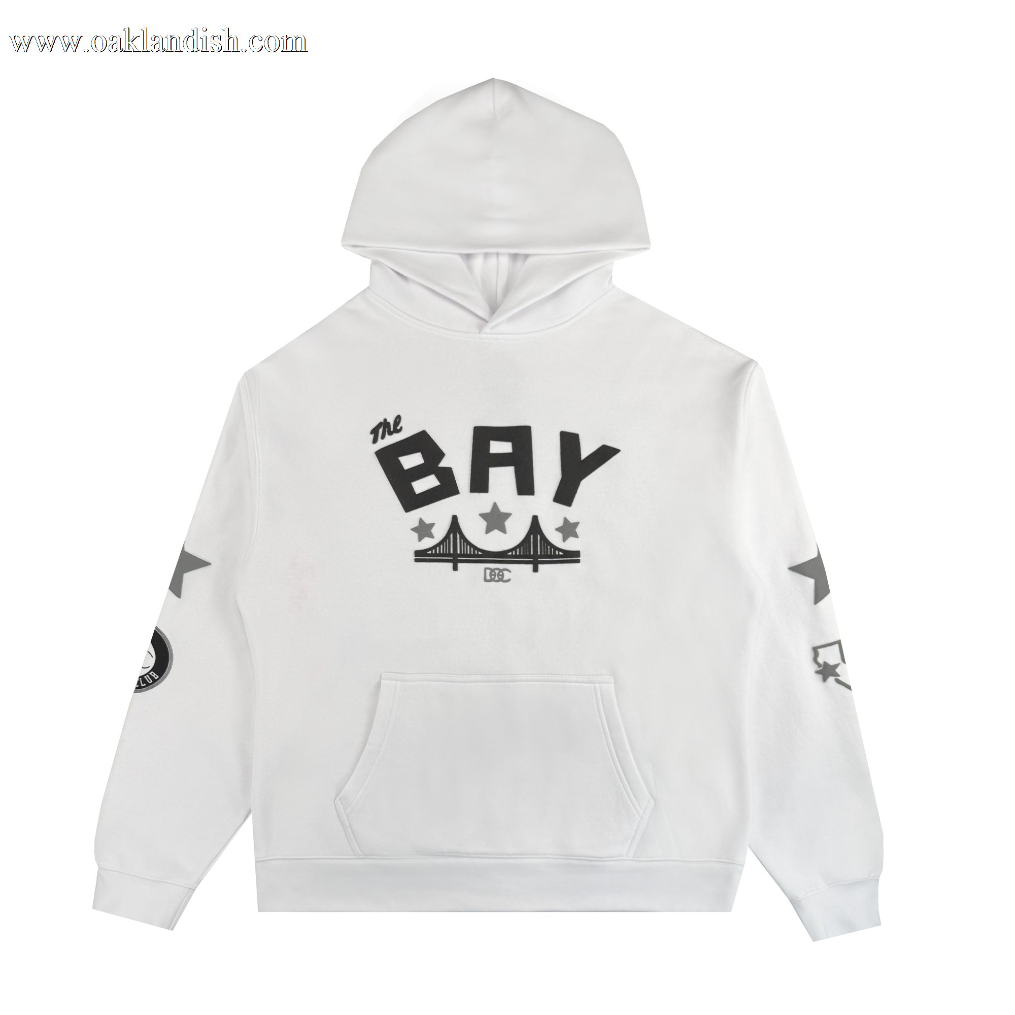 The Bay Bridge Hoodie By DOC V2 by Oaklandish is a white pullover with a front pocket, "THE BAY" in bold black letters above a bridge graphic, black stars on the sleeves, and a black-and-white patch on the right sleeve.
