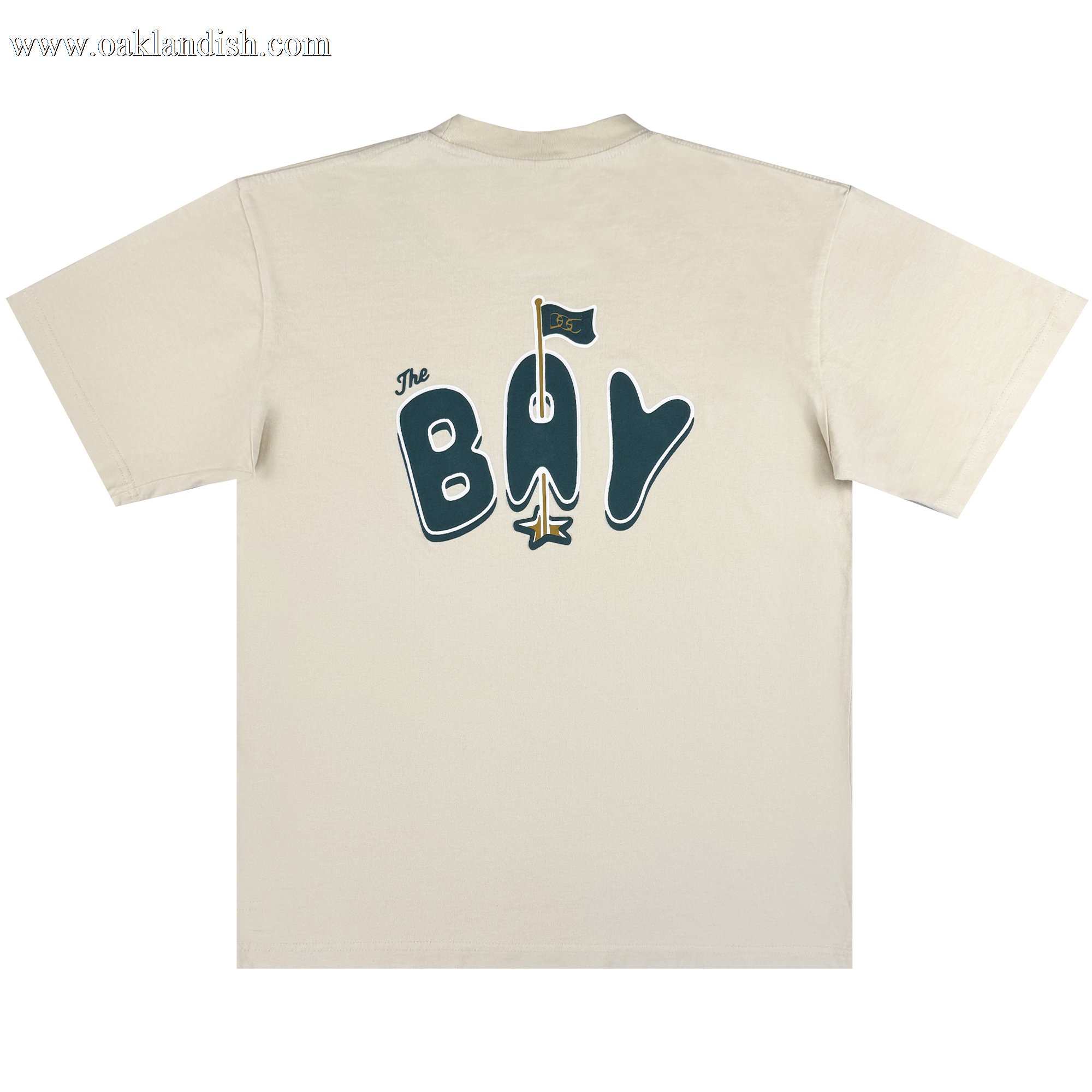 The Bay Flag Tee By DOC by Oaklandish is a heavyweight beige cotton classic fit tee with “The BAY” in bold blue on the back, plus a yellow bridge “A” and flag celebrating Golden State Warriors Bay Area pride. White background.