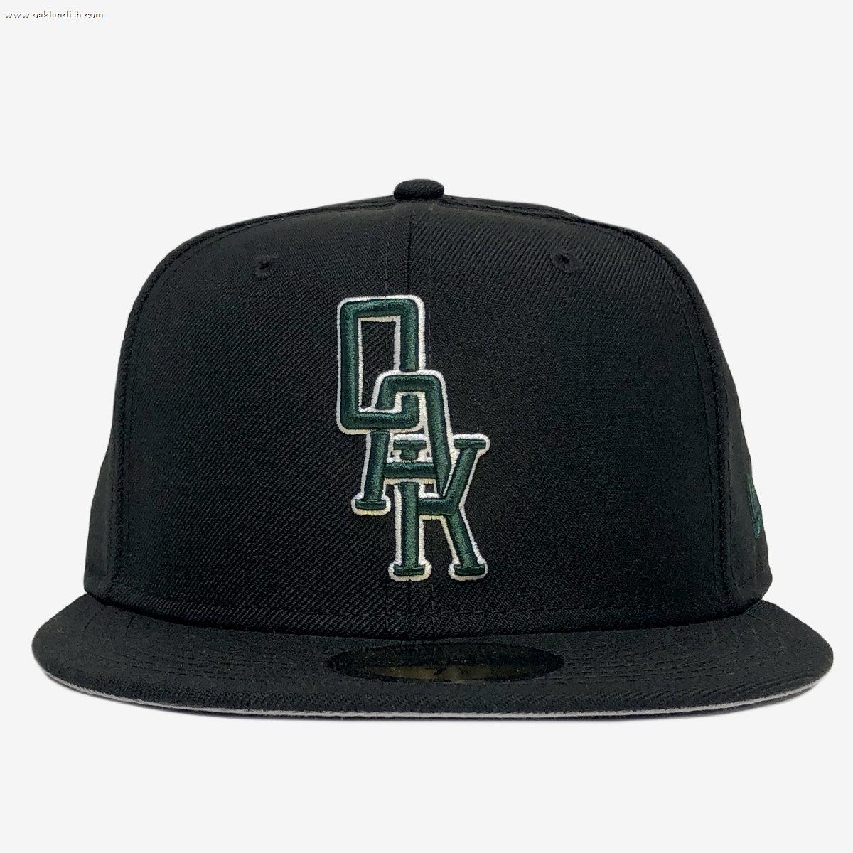 A New Era OAK 59FIFTY Fitted Cap by Other in black, featuring green and white vertically stacked “OAK” logo embroidery on the front panel, displayed against a plain white background.