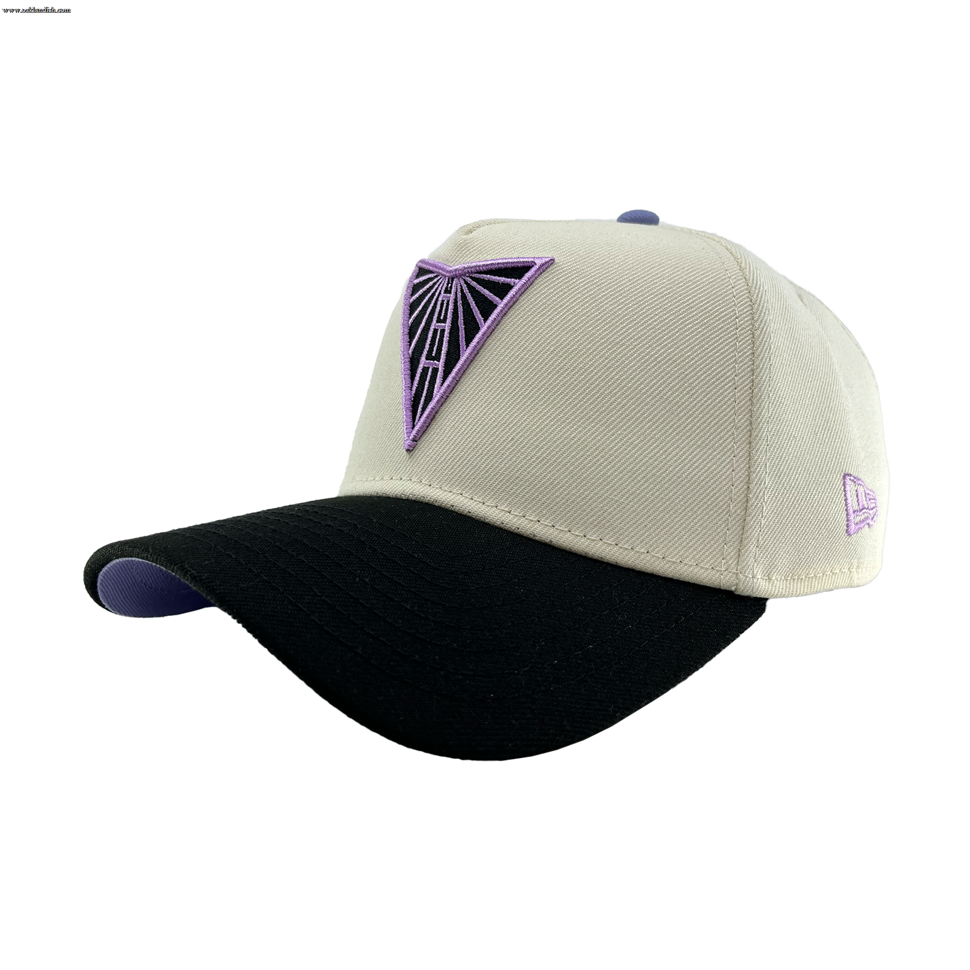 The GSV 9FORTY AF 2 Tone cap by GSV features a beige crown, black curved brim with a purple underside, and purple geometric triangle logo on the front. A small purple logo is stitched on the left side. Adjustable New Era snapback.