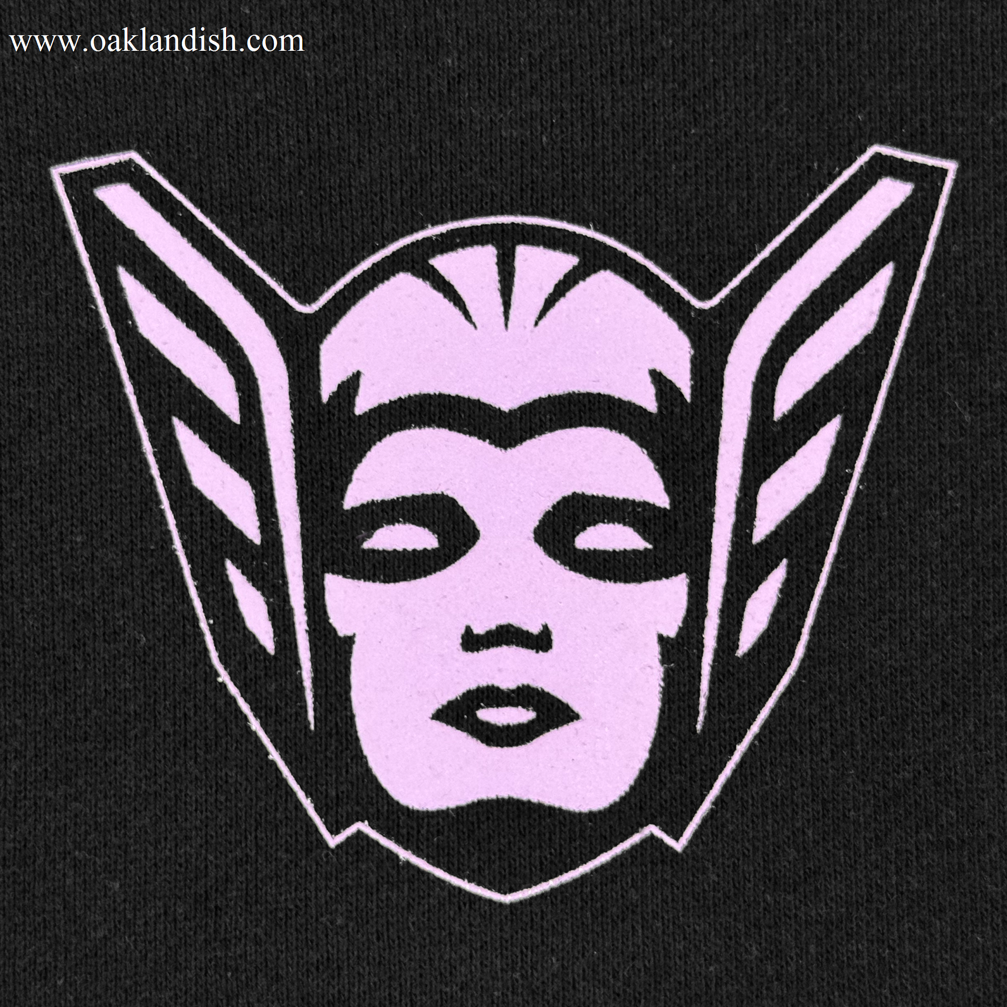 The GSV Renowned Hoodie by GSV features a stylized pink face with closed eyes and lips, bold black outlines, and two wing-like shapes on a sleek black background—ideal for any fan of the Golden State Valkyries.