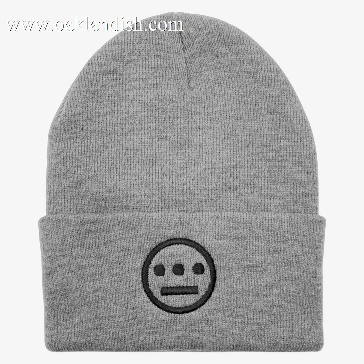 The Hiero Classic Cuff Beanie by Hieroglyphics is a gray beanie with a folded brim, featuring an embroidered black circular logo. The logo showcases three horizontally aligned dots above two vertical dashes, forming a hieroglyphics-inspired face design on a white background.