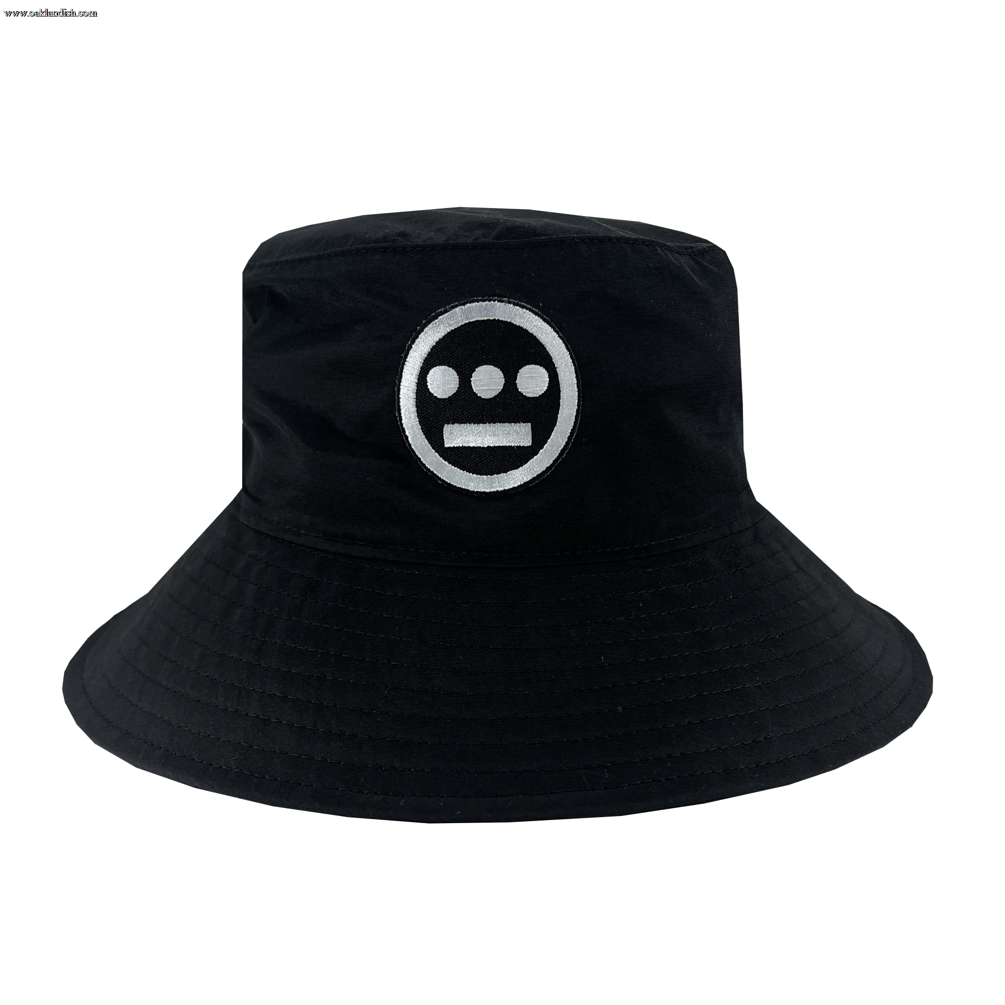 The Hiero Boonie Hat by Hieroglyphics is a black bucket hat crafted from recycled nylon, showcasing a striking white circular logo on the front. The logo features a solid circle with three smaller, evenly spaced circles inside it and three horizontal bars beneath them. This hat is designed with a wide, downward-sloping brim and visible stitching along the edges.