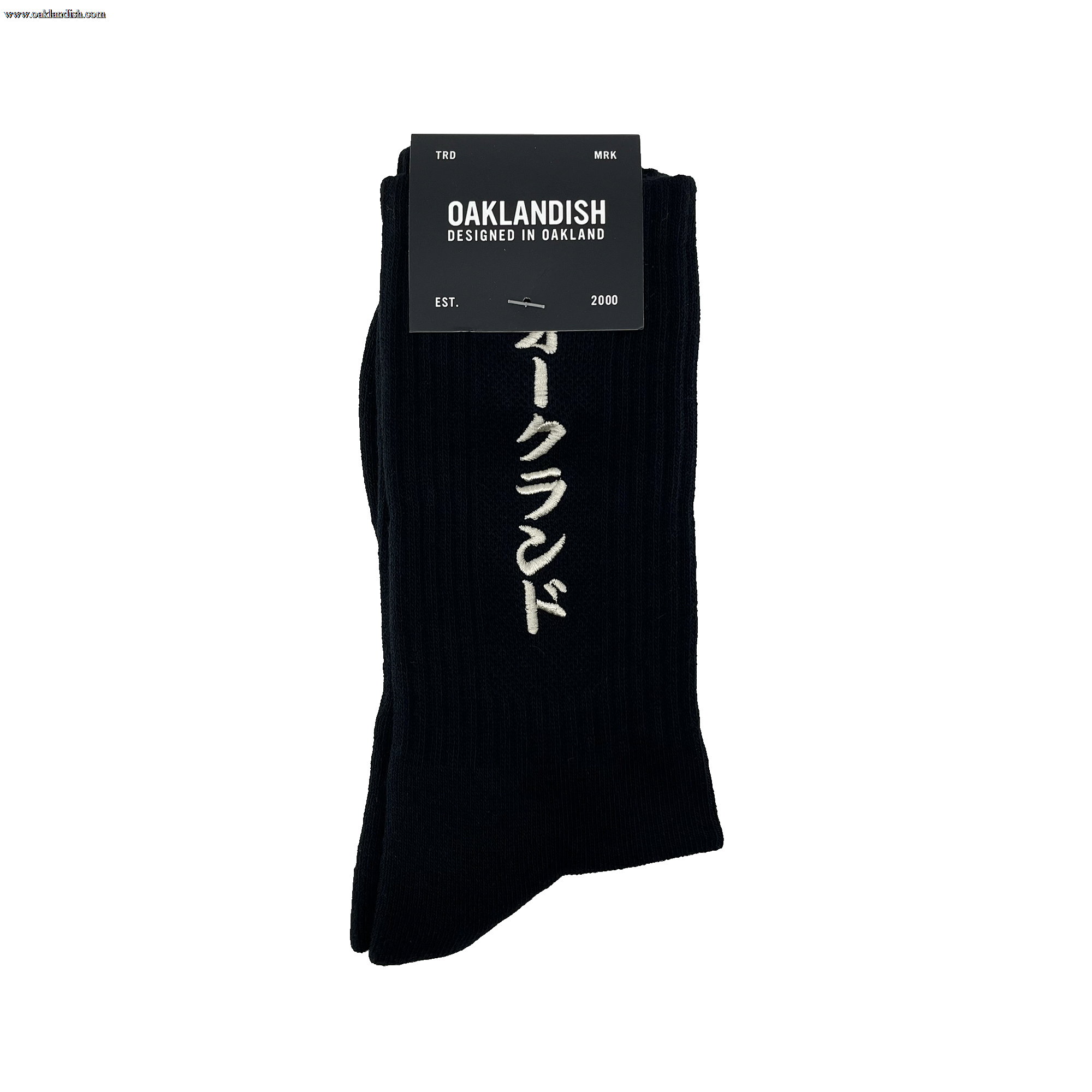 Pair folded black crew socks in Oaklandish packaging with a white embroidered Kanji Japanese script wordmark on the sock.