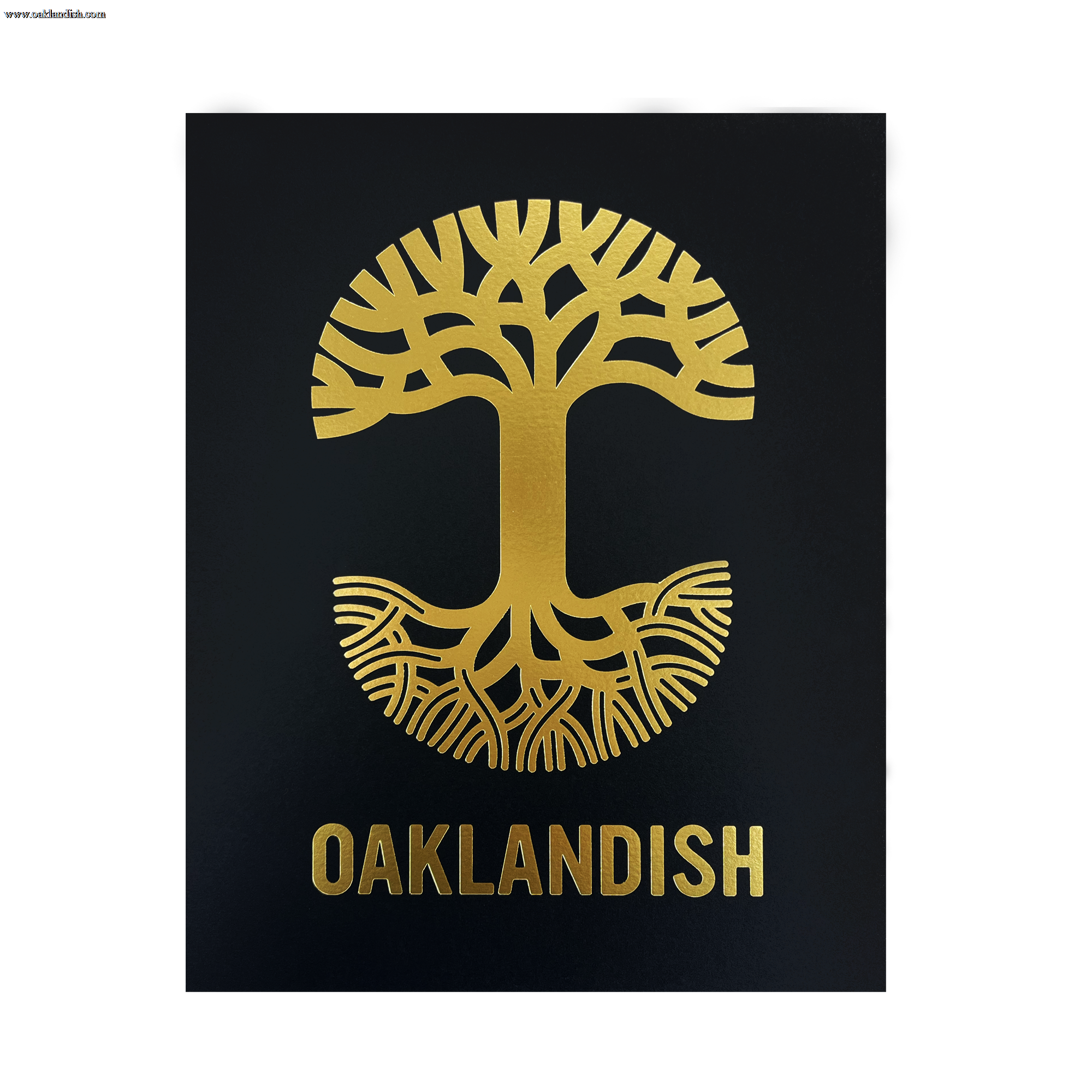 The Oaklandish New Logo Print by Never Elsewhere showcases a gold emblem of a stylized tree with branches extending upwards and roots spreading downwards against a black background. Below the tree, the word "OAKLANDISH" is also rendered in gold, complementing the emblem. The design has a symmetrical and minimalist aesthetic reminiscent of a letterpress print.