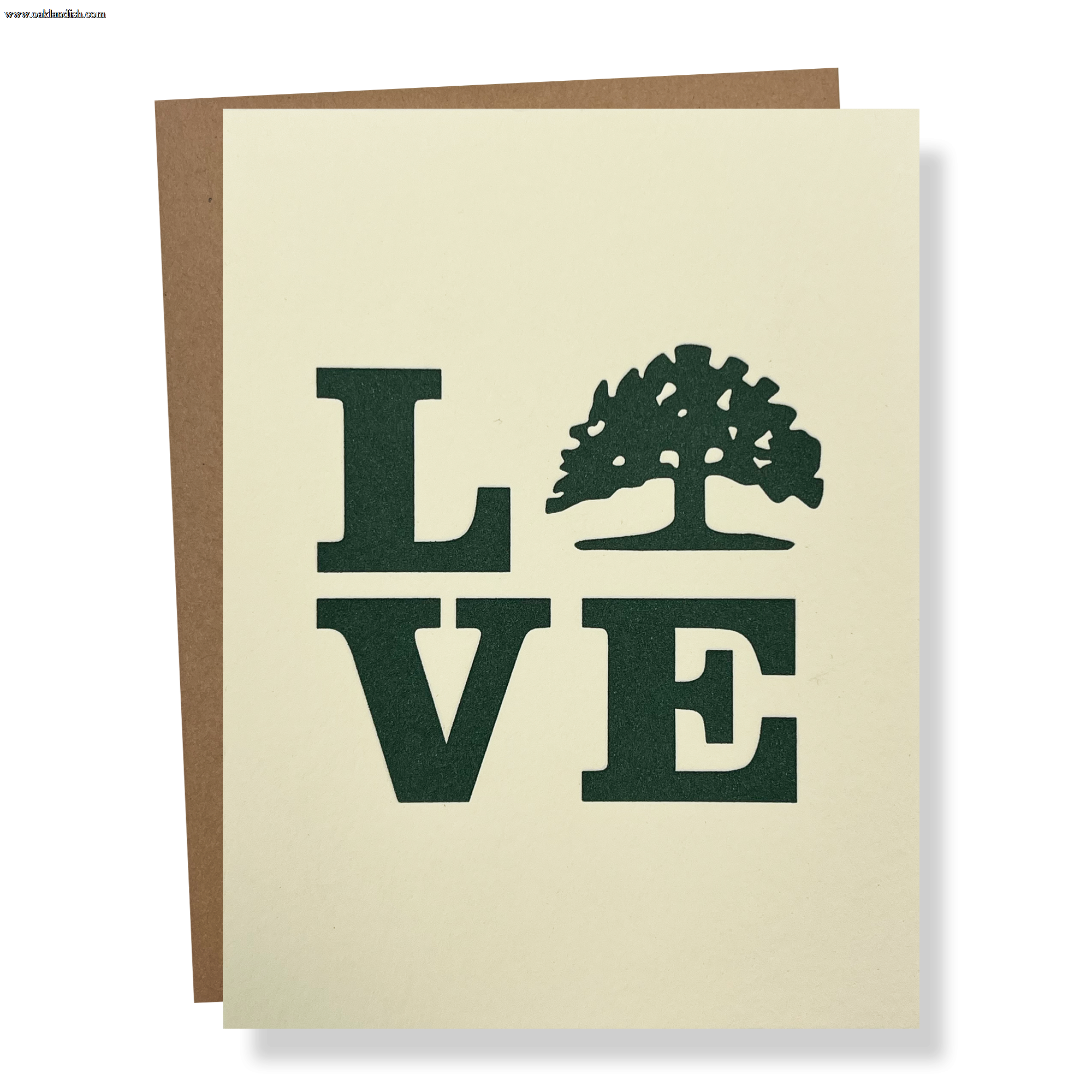 The Love Tree Card by Never Elsewhere features the word "LOVE" in bold, dark green letters on a cream background, with the "O" creatively represented by a tree silhouette. Crafted in Oakland, the card is displayed partially open, showcasing a brown inside flap.