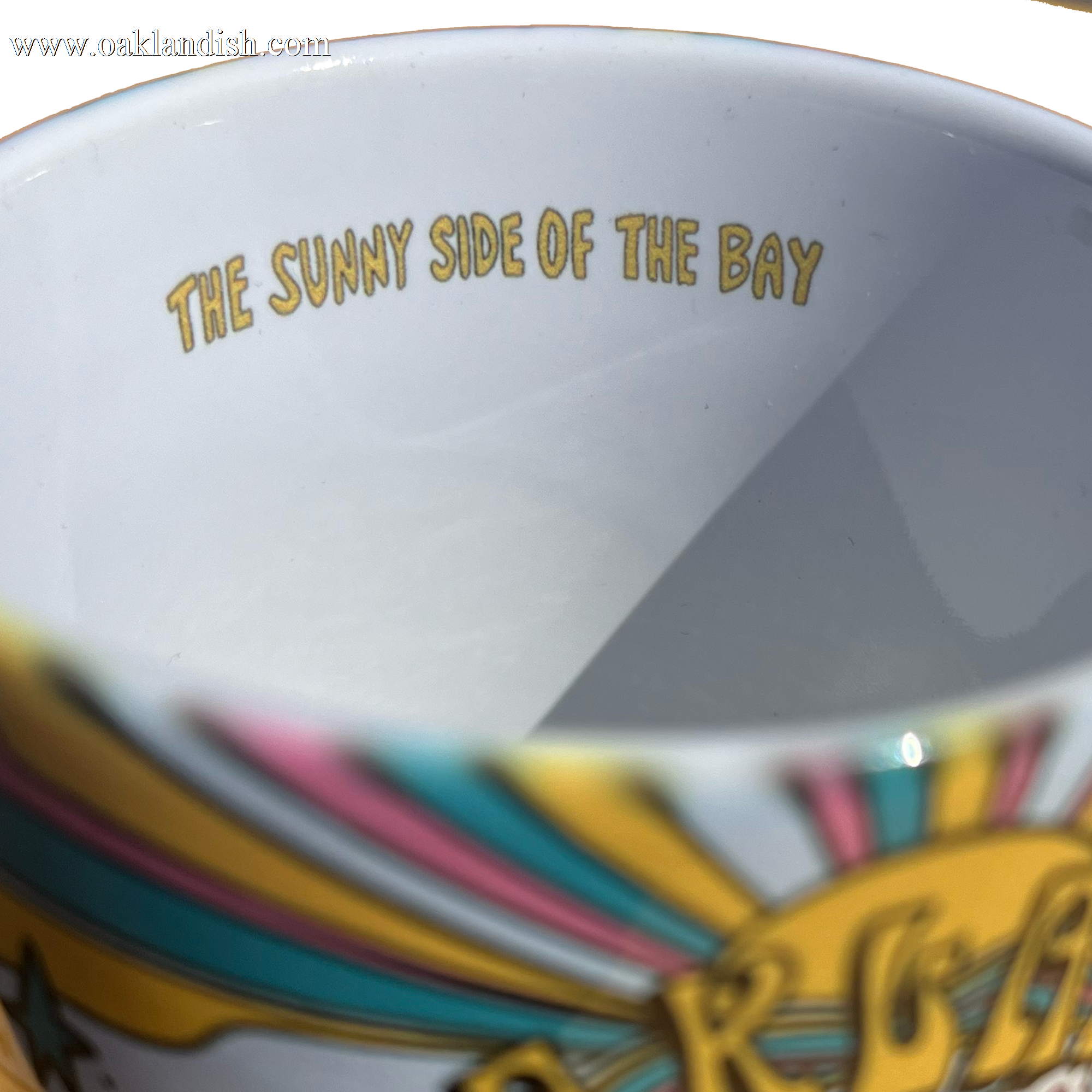 Inside view Oakland Dream mug with Oakland dream all over print and C handle and 'The sunny side of the bay' text.