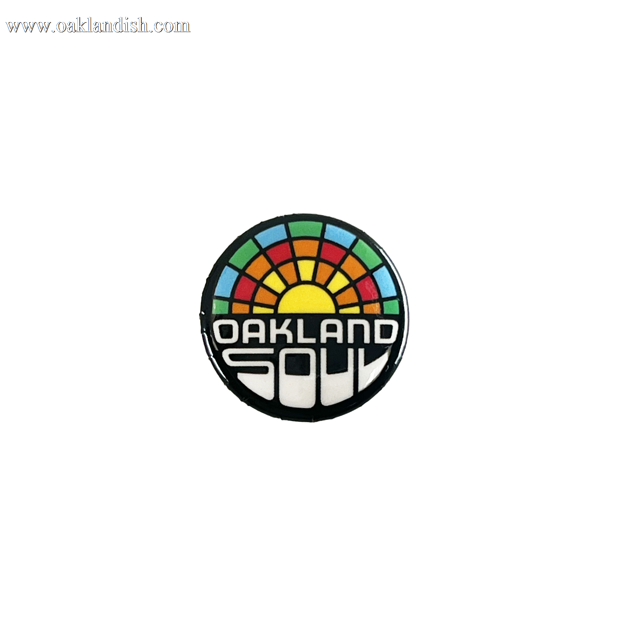 The Oakland Soul Pin features a vibrant design with a yellow sun at the center, radiating rainbow-colored segments. Below the sun, bold white text reads "OAKLAND SOUL," paying homage to Oakland's USL W-League women's soccer team. The background is black.