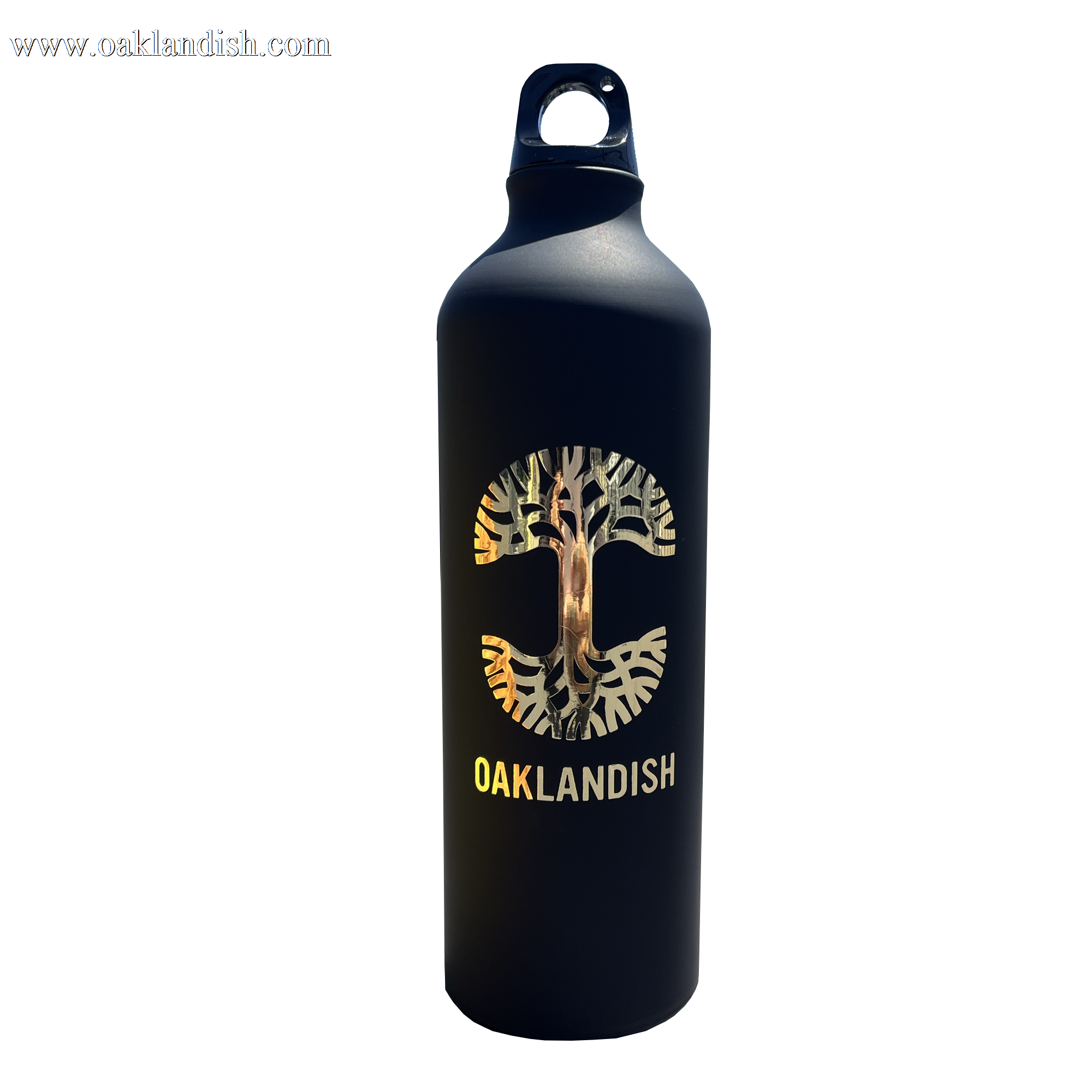 The Oaklandish Logo Aluminum Water Bottle by Oaklandish is crafted from single-wall aluminum and features a striking black exterior. The front showcases the iconic Oaklandish tree logo nestled within a circular "C" shape, along with "OAKLANDISH" boldly displayed beneath in uppercase white letters. It comes with a convenient looped handle cap for easy carrying, set against a plain white background.