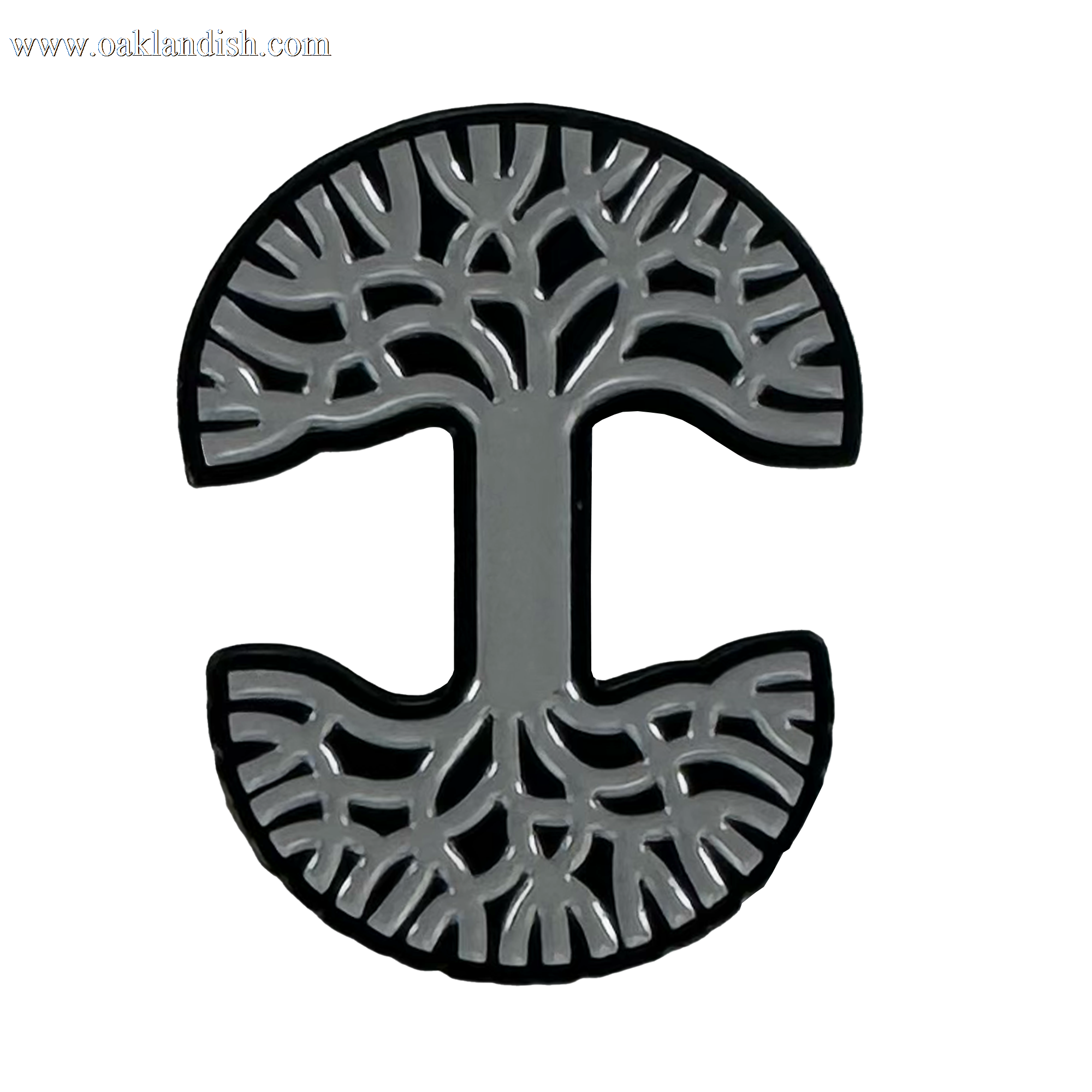 The Oaklandish Logo Enamel Pin by Oaklandish is a circular, grey enamel pin with a capital “I” at the center, tree branches above, roots below, and a black outline on a white background.