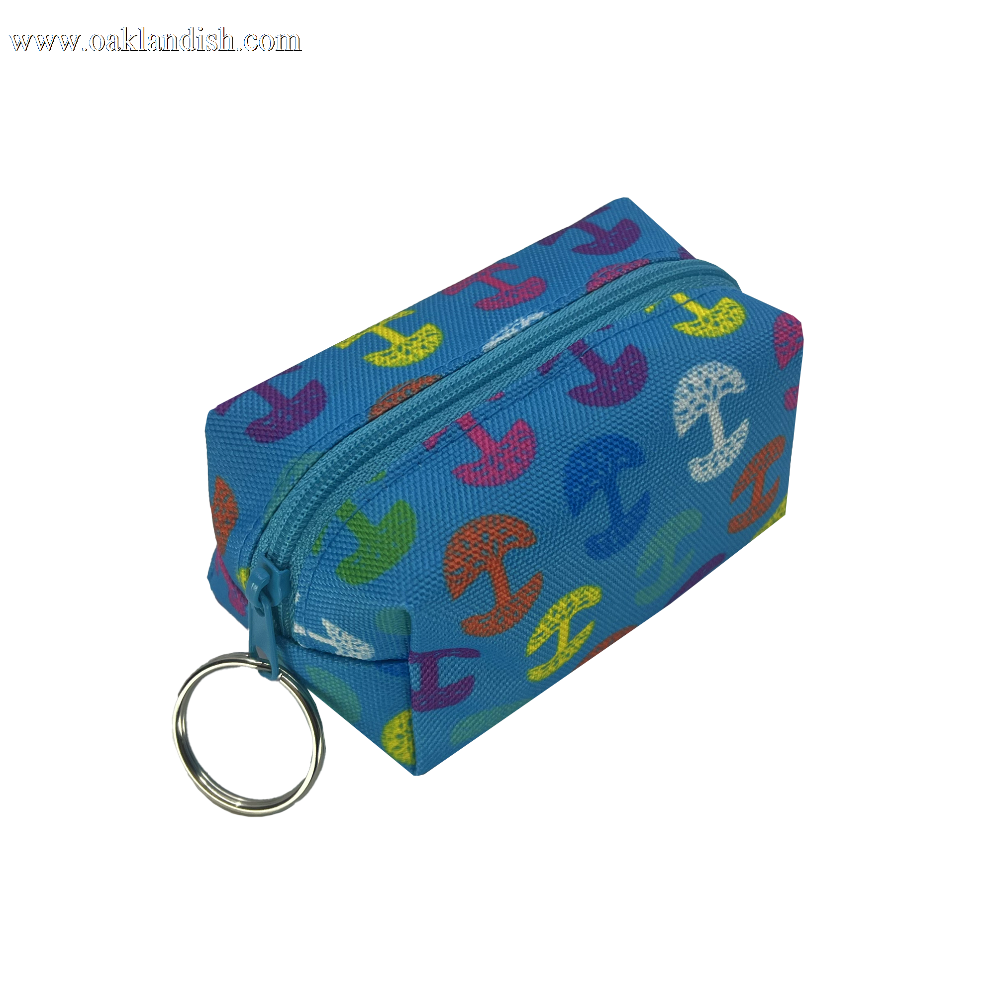 The Oaklandish Repeat Tree Mini Dopp by Oaklandish is a small, rectangular polyester keychain pouch adorned with colorful anchors in red, yellow, green, orange, and purple. This mini keychain pouch features a metal keyring attached to one end for easy attachment to keys or other items and has a top zippered compartment that is closed.