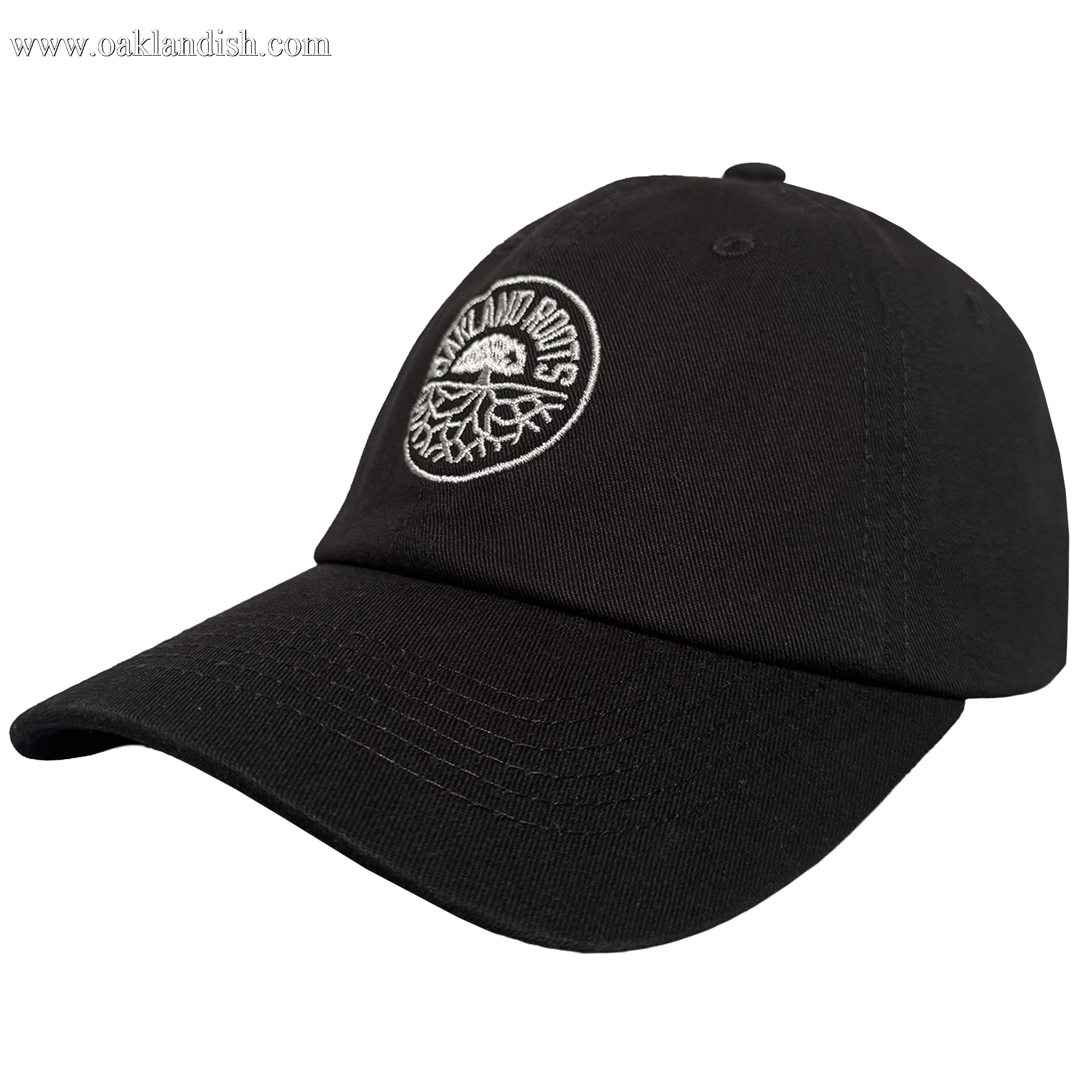 The ORSC Dad Hat by Oakland Roots SC is a black cap with a curved brim and an embroidered white circular "OAKLAND ROOTS" logo above a stylized tree, ideal for fans. Displayed on a plain, light background.