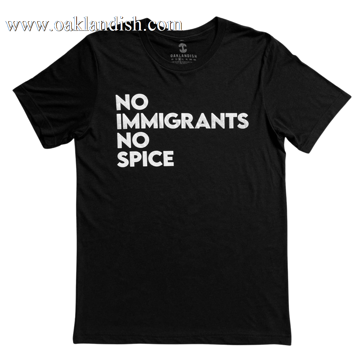 The NINS Classic Tee by Oaklandish features a round neck and short sleeves, with bold white text that reads "NO IMMIGRANTS NO SPICE" arranged in three lines against its black fabric. Faintly branded inside the collar, this shirt proudly supports immigrant rights and is presented laid flat against a plain white background.