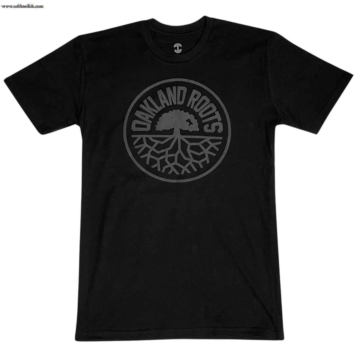 Introducing the Oakland Roots SC Blackout Logo Tee, a black T-shirt proudly featuring a circular emblem at its center. The text "OAKLAND ROOTS" is elegantly arched along the outer edge of the circle, enclosing an intricate illustration of a tree with expansive roots. This design symbolizes both Oaklandish pride and unwavering support for your favorite sports club. The dark-shaded design elements create a subtle yet striking contrast against the black fabric, making it a must-have for any fan.