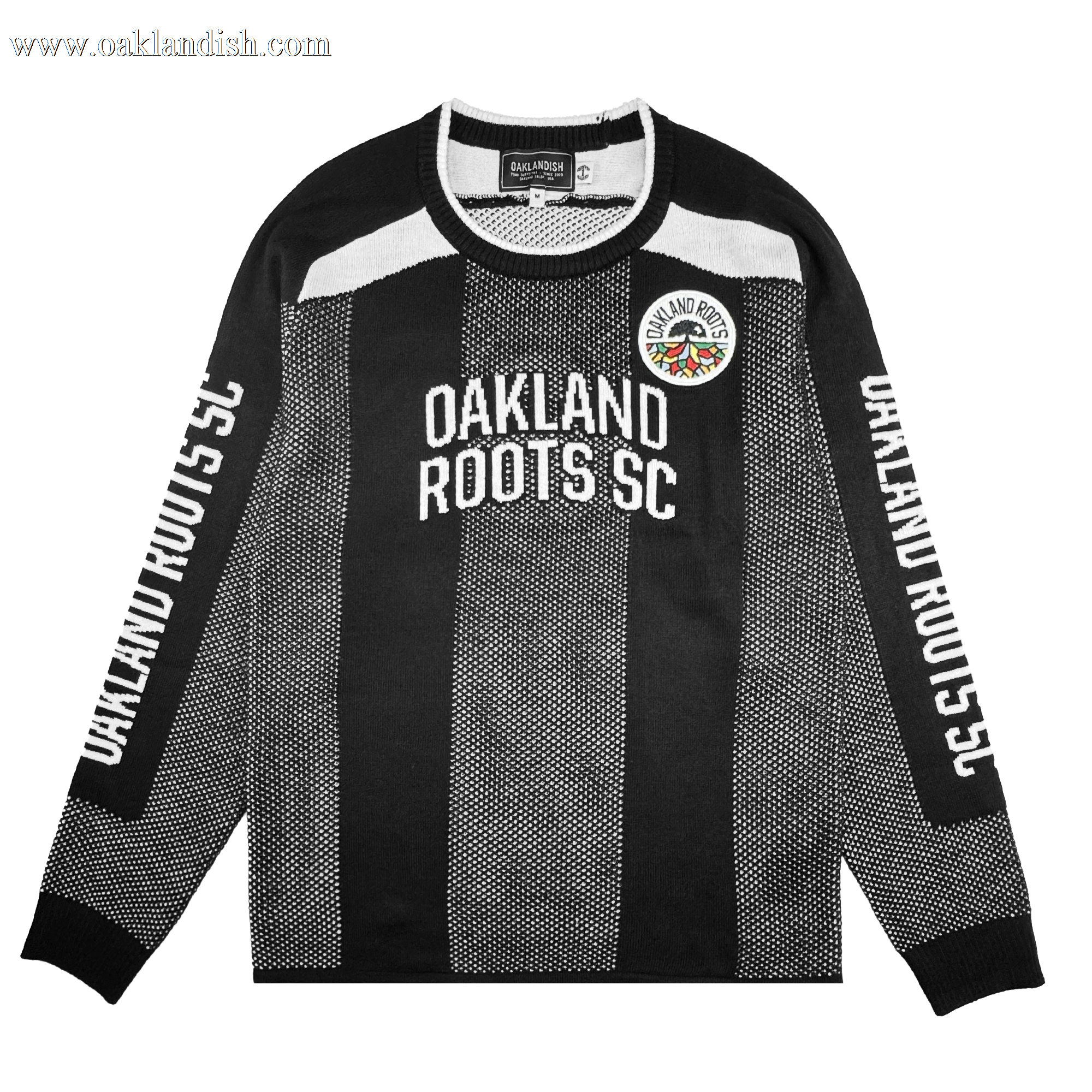 The Oakland Roots SC Clubhouse Sweater is a black long-sleeve by Oakland Roots SC featuring white "OAKLAND ROOTS SC" text on the chest and sleeves, vertical dotted stripes, a club crest patch, and black-and-white collar and cuffs.